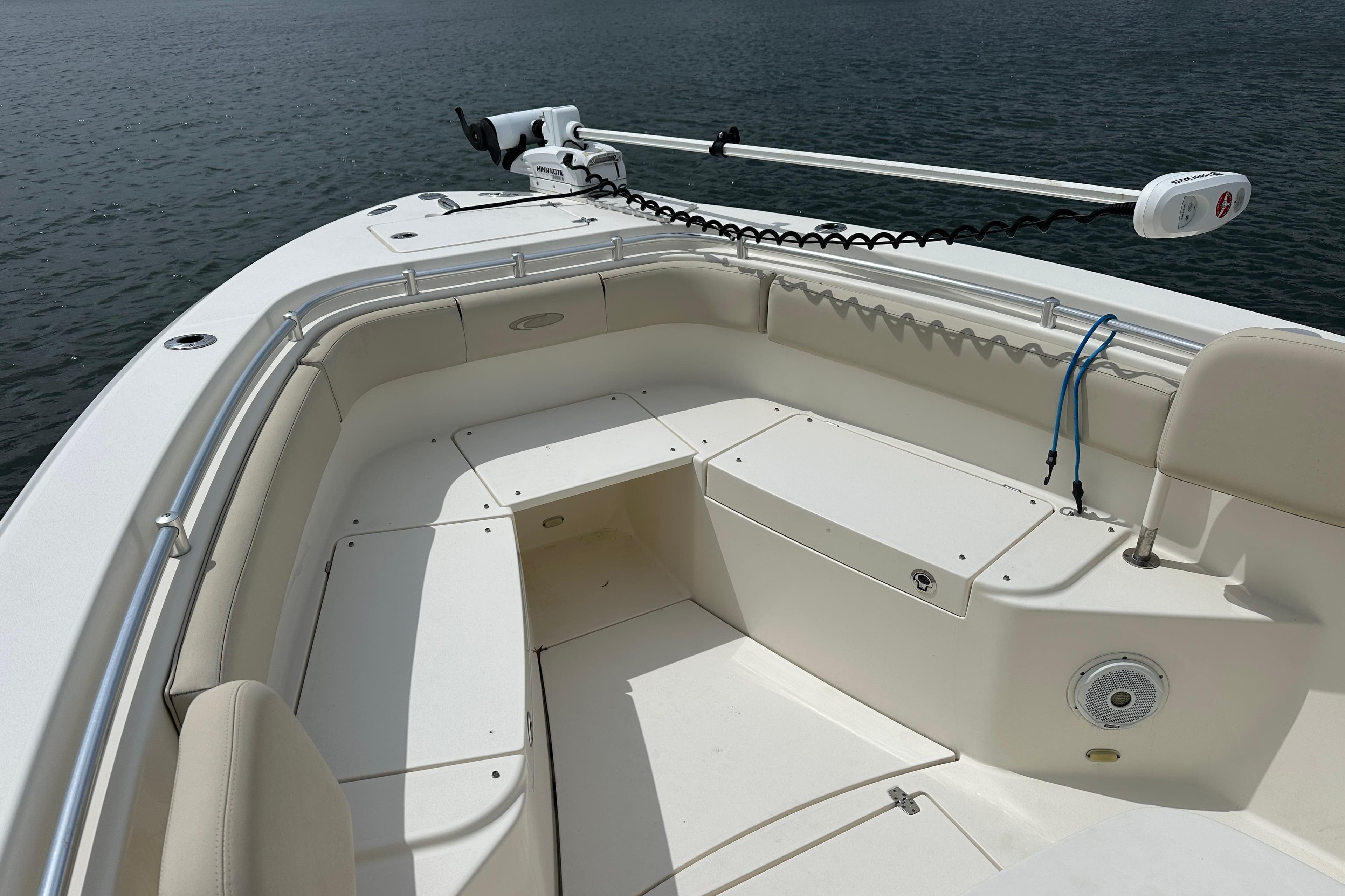 2016 Cobia 277 Center Console boat with spacious seating and trolling motor.