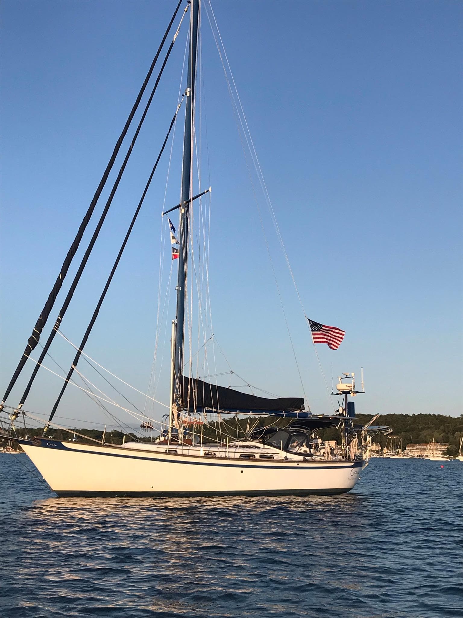 1981 Southern Cross 39' sailboat on calm water with American flag.