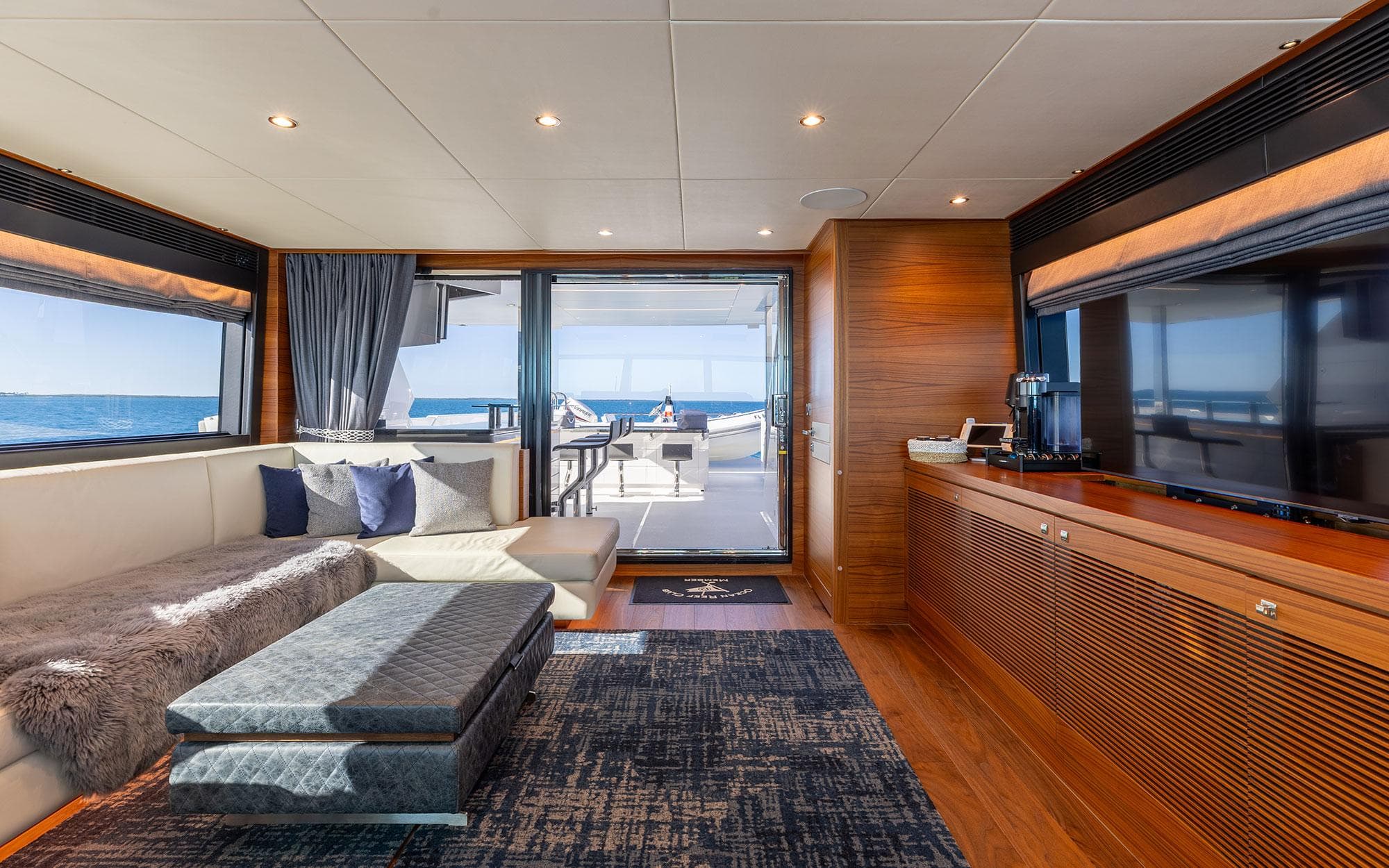 Luxurious interior of 2022 Horizon FD 92 yacht with ocean view and modern furnishings.