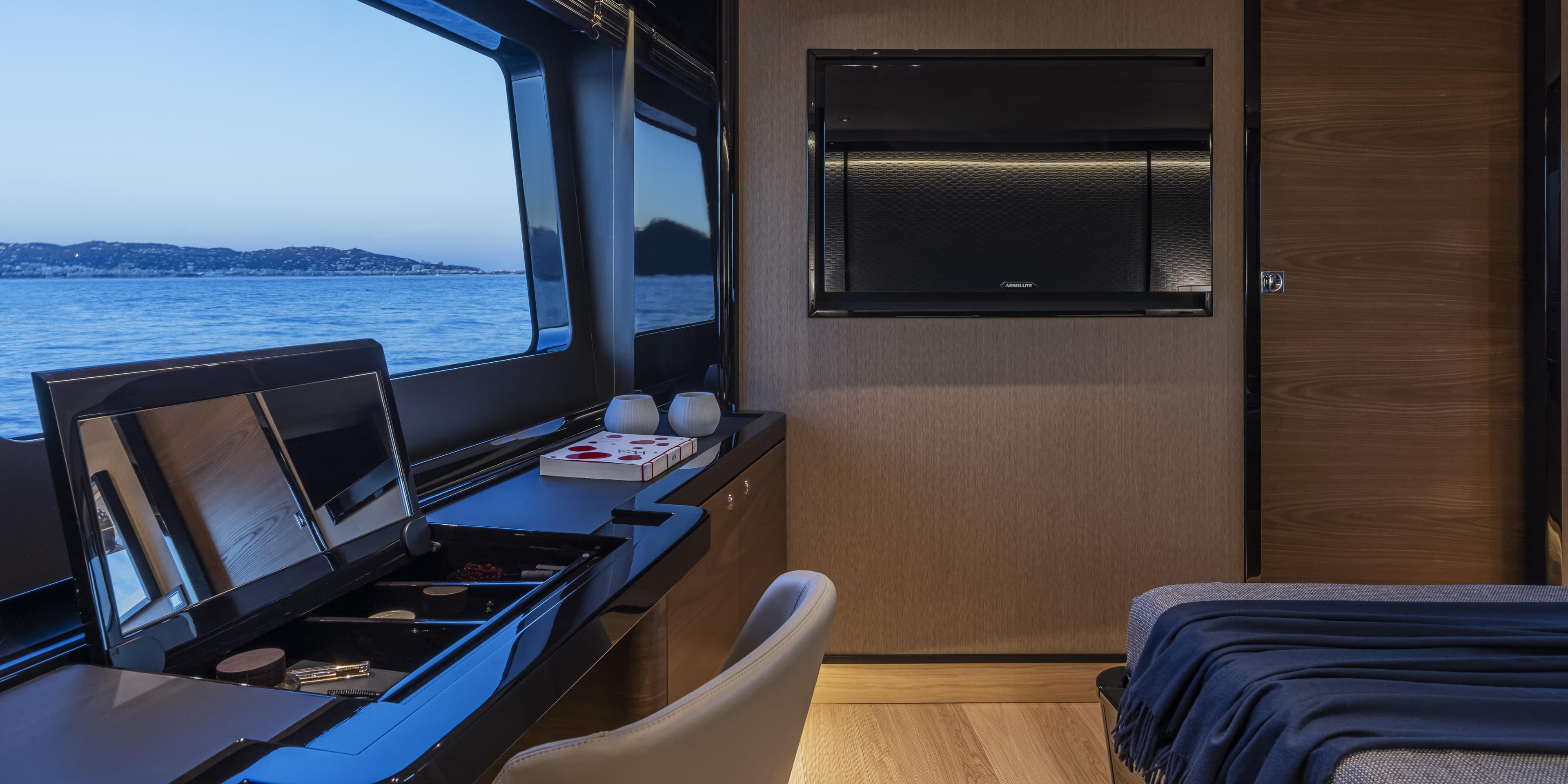 Luxurious interior of 2025 Absolute NAVETTA 75 yacht with ocean view.