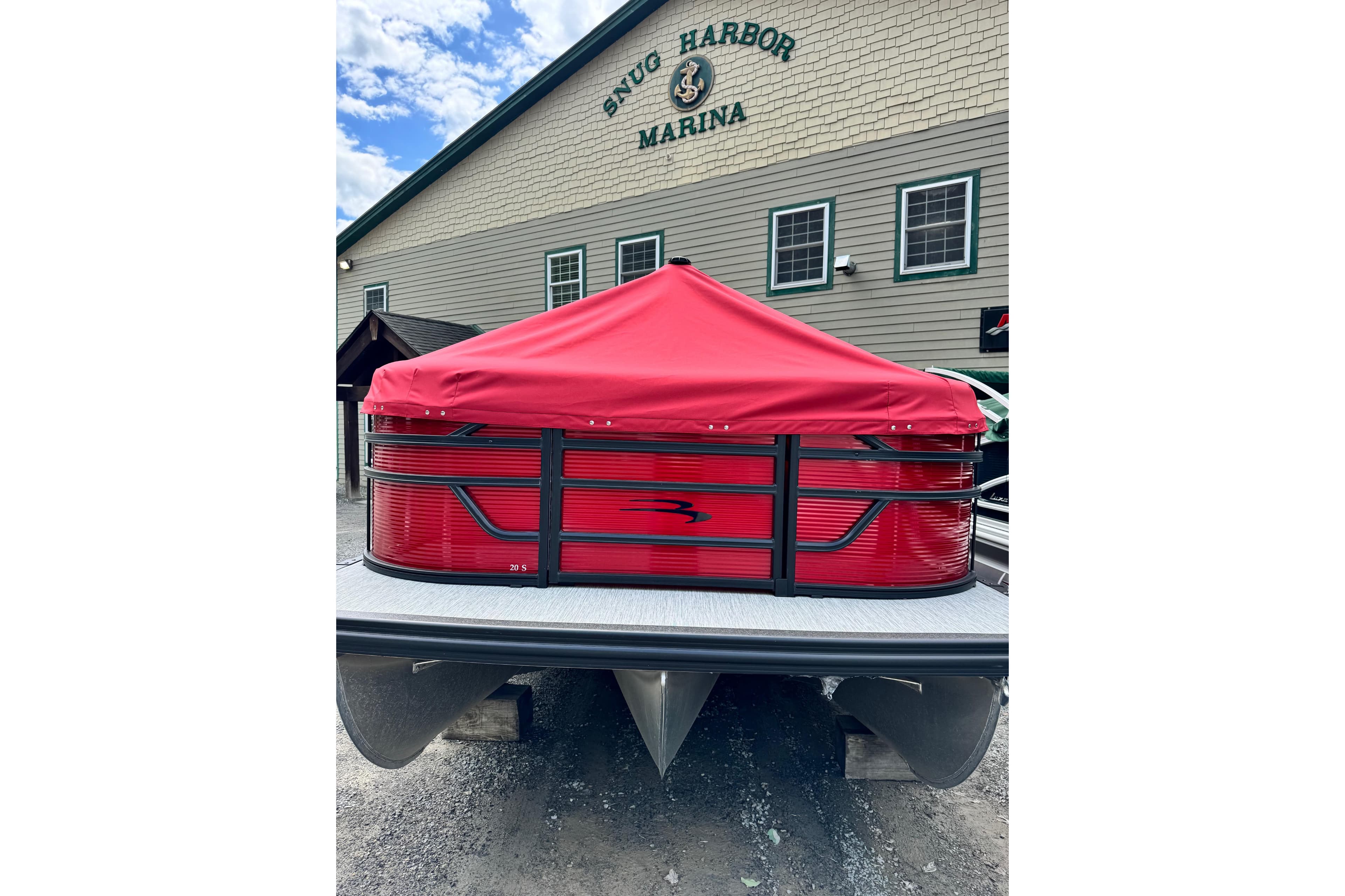 2026 Bennington S 20 SSR pontoon boat with red cover at Snug Harbor Marina.