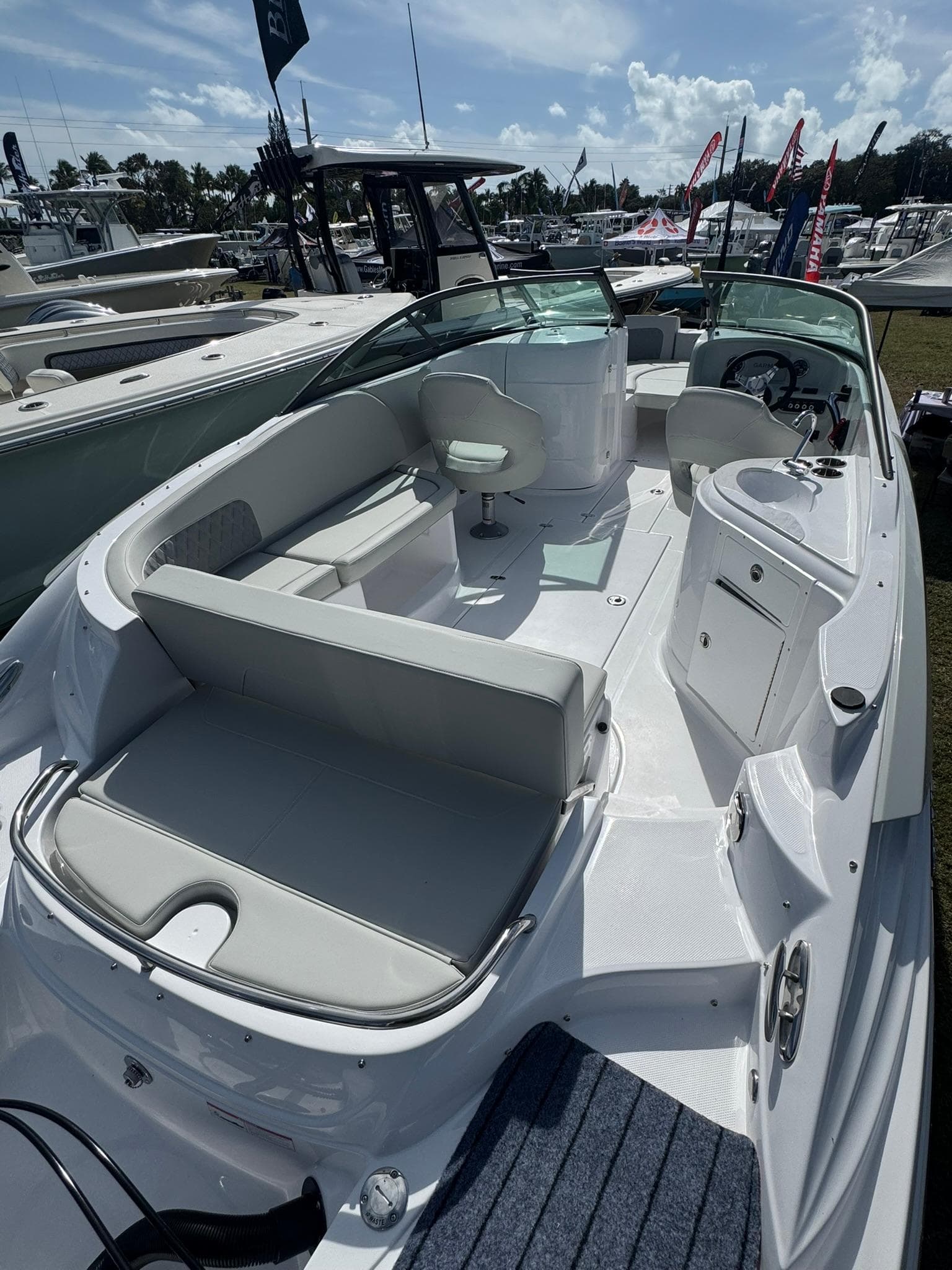 2025 SouthWind 2600 boat with spacious seating and modern design at a marina.