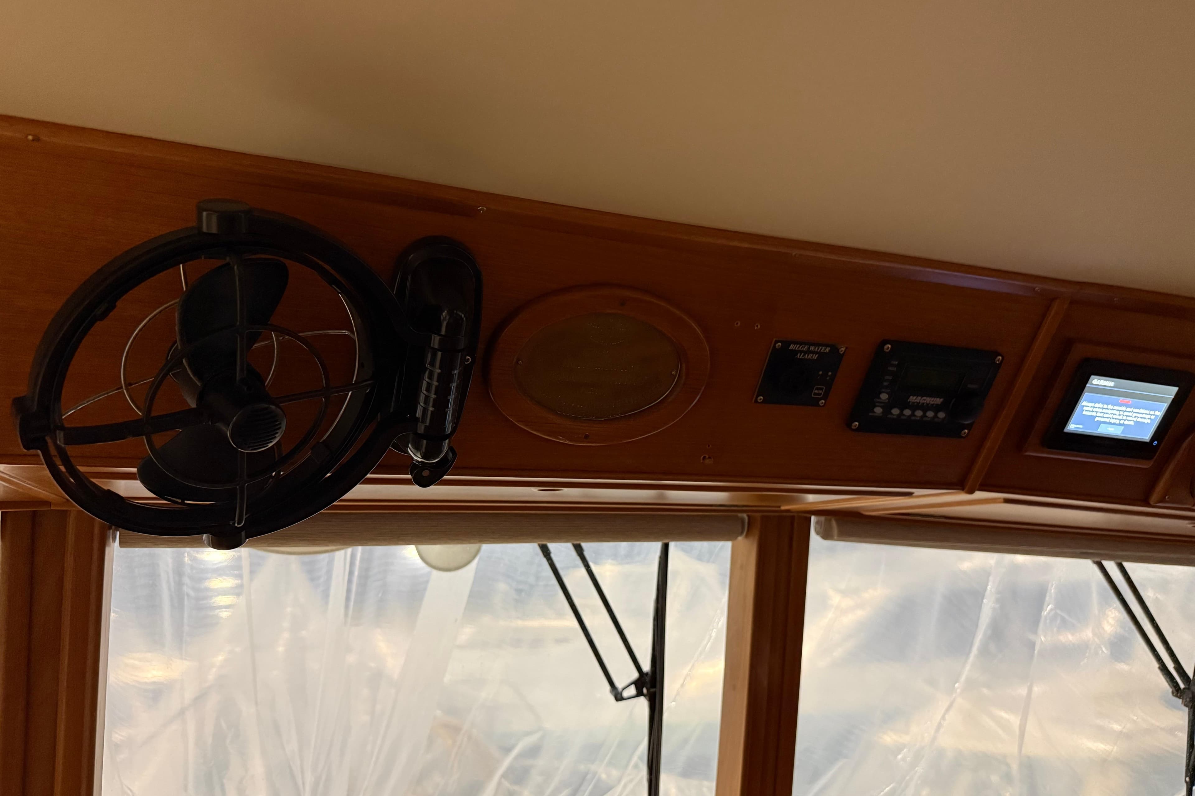 Interior view of a 1991 Grand Banks 42 Classic yacht dashboard with fan and controls.