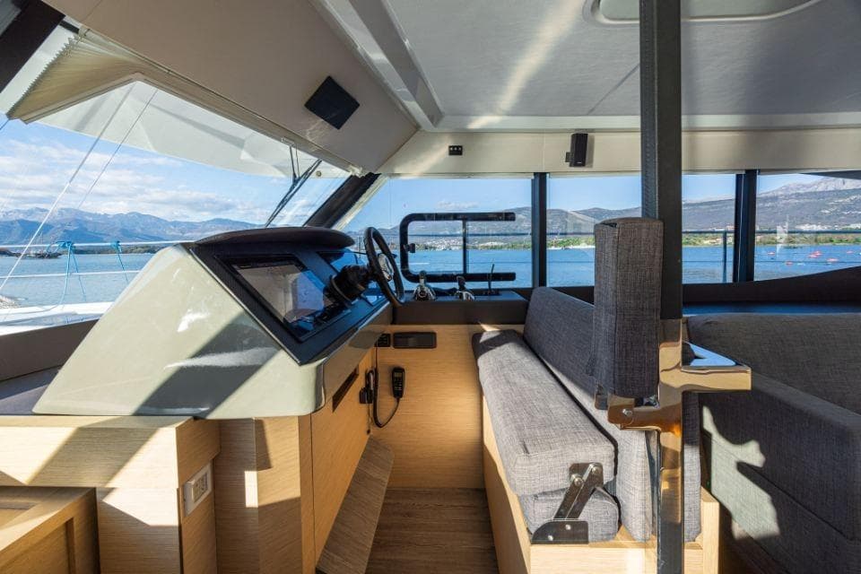 Interior view of 2019 Fountaine Pajot Motor Yacht 44 helm with panoramic windows.