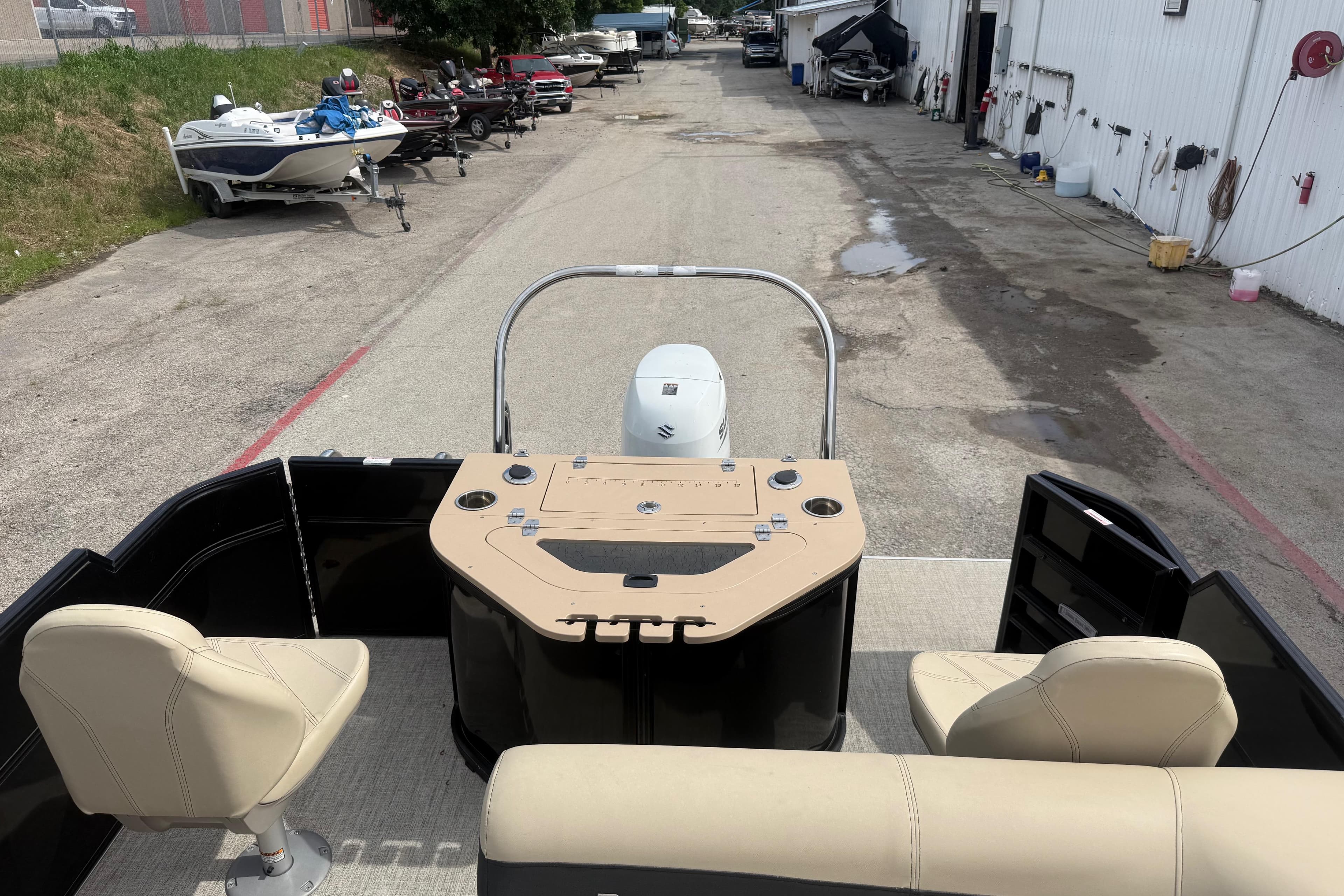 2023 Berkshire 20A CTS pontoon boat interior with beige seating and control panel.