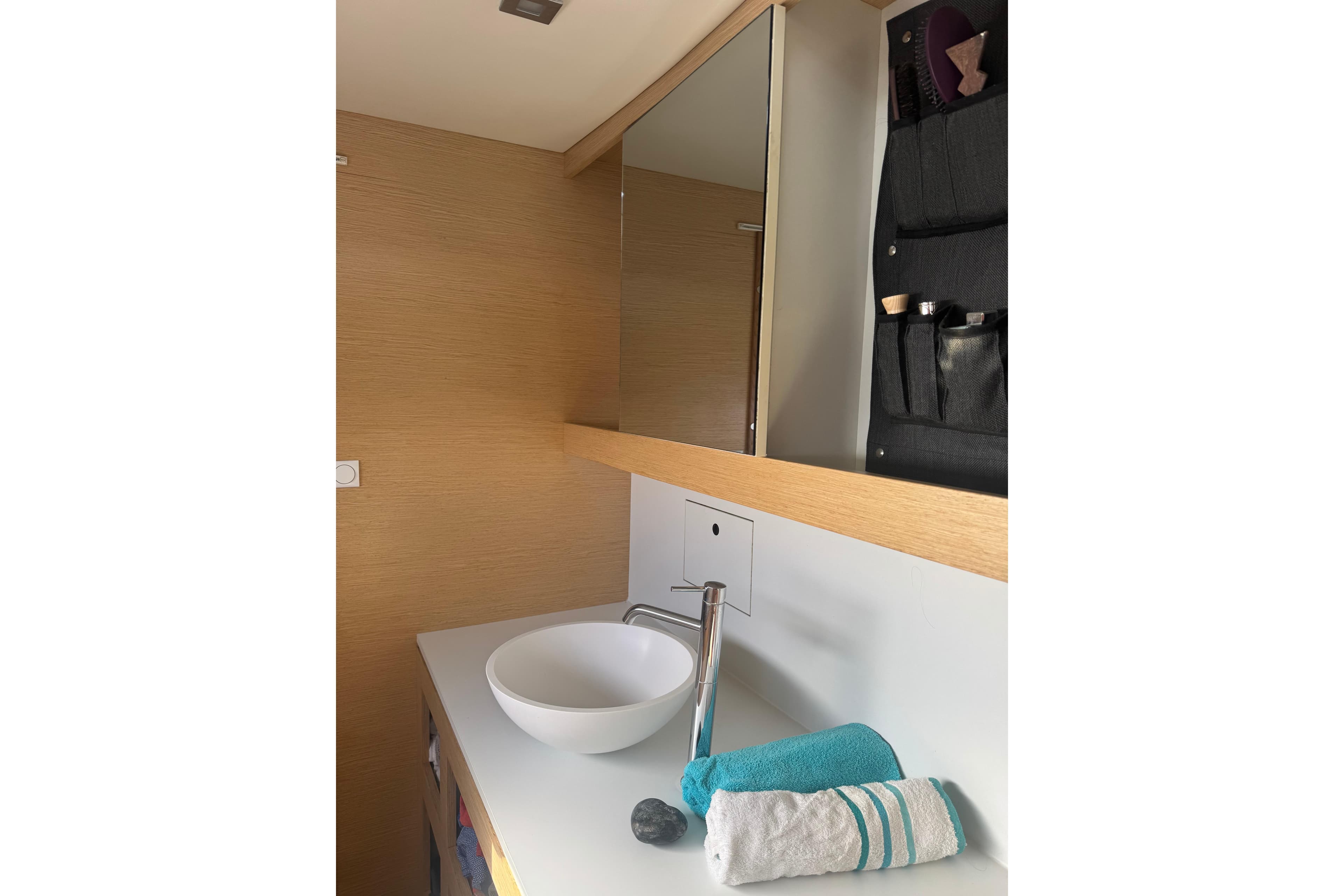 Bathroom interior of 2018 Outremer 4X yacht with modern sink and towels.