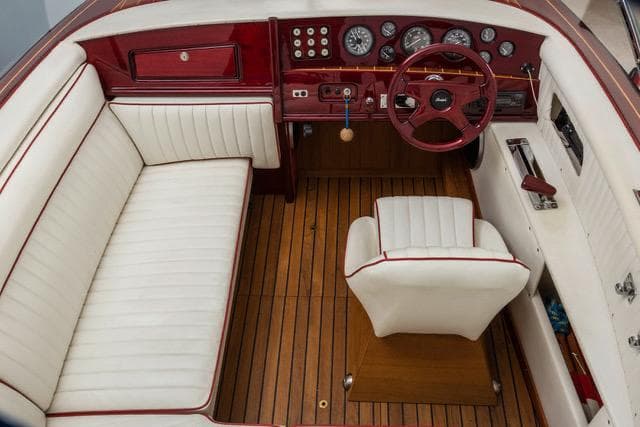 1995 Boesch 620 Cabrio de Luxe interior with white leather seats and wooden dashboard.