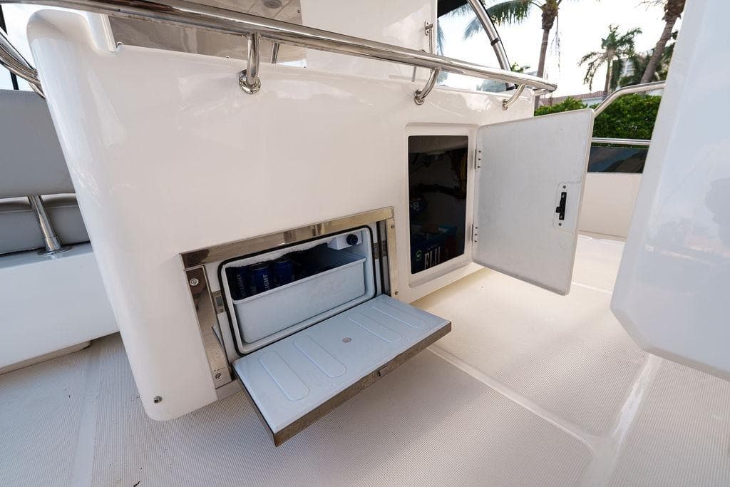 2023 Aquila 44 Yacht interior with open storage compartments and sleek design.