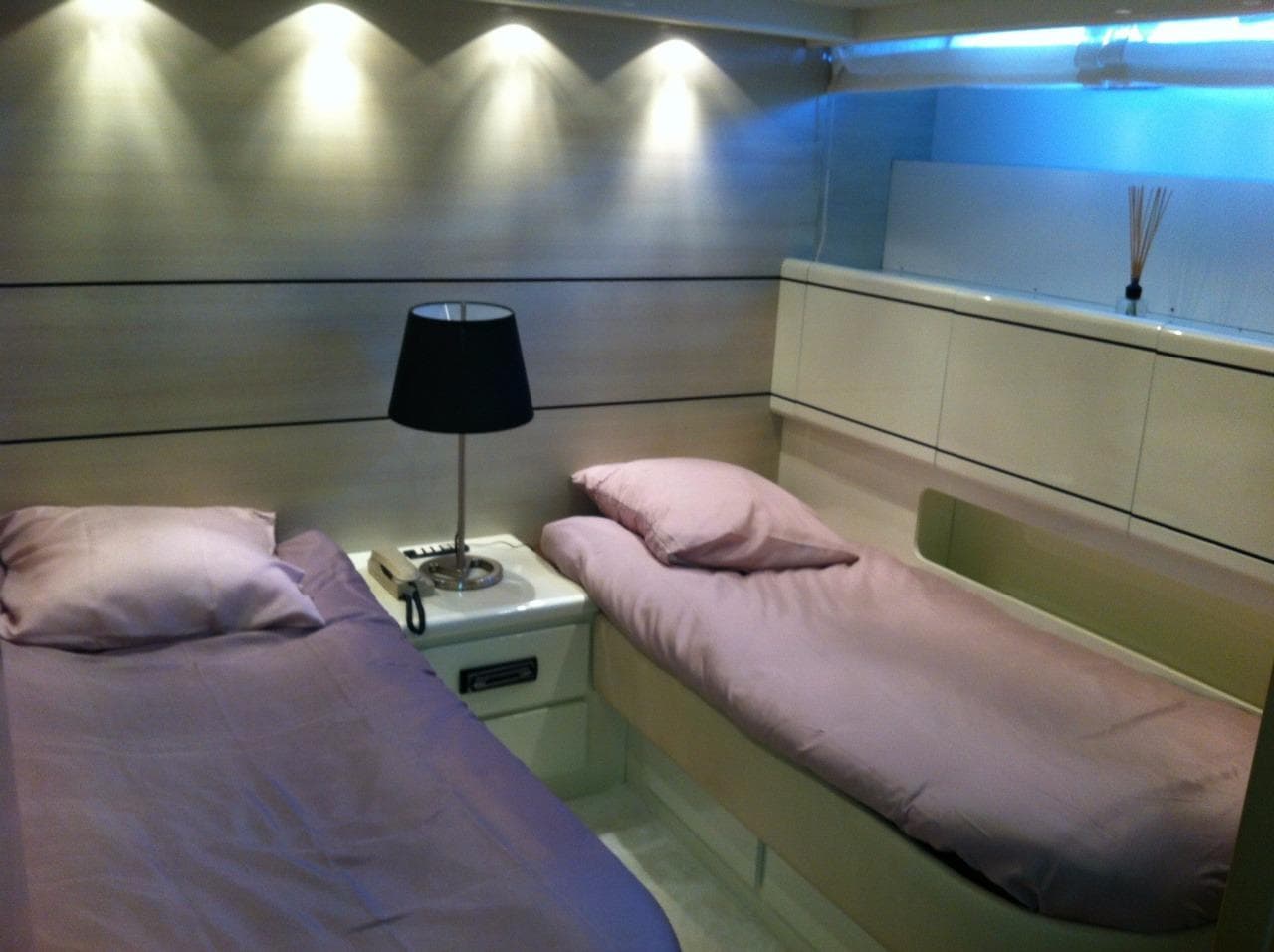 Interior of 1994 Overmarine Mangusta 80 yacht with two beds.