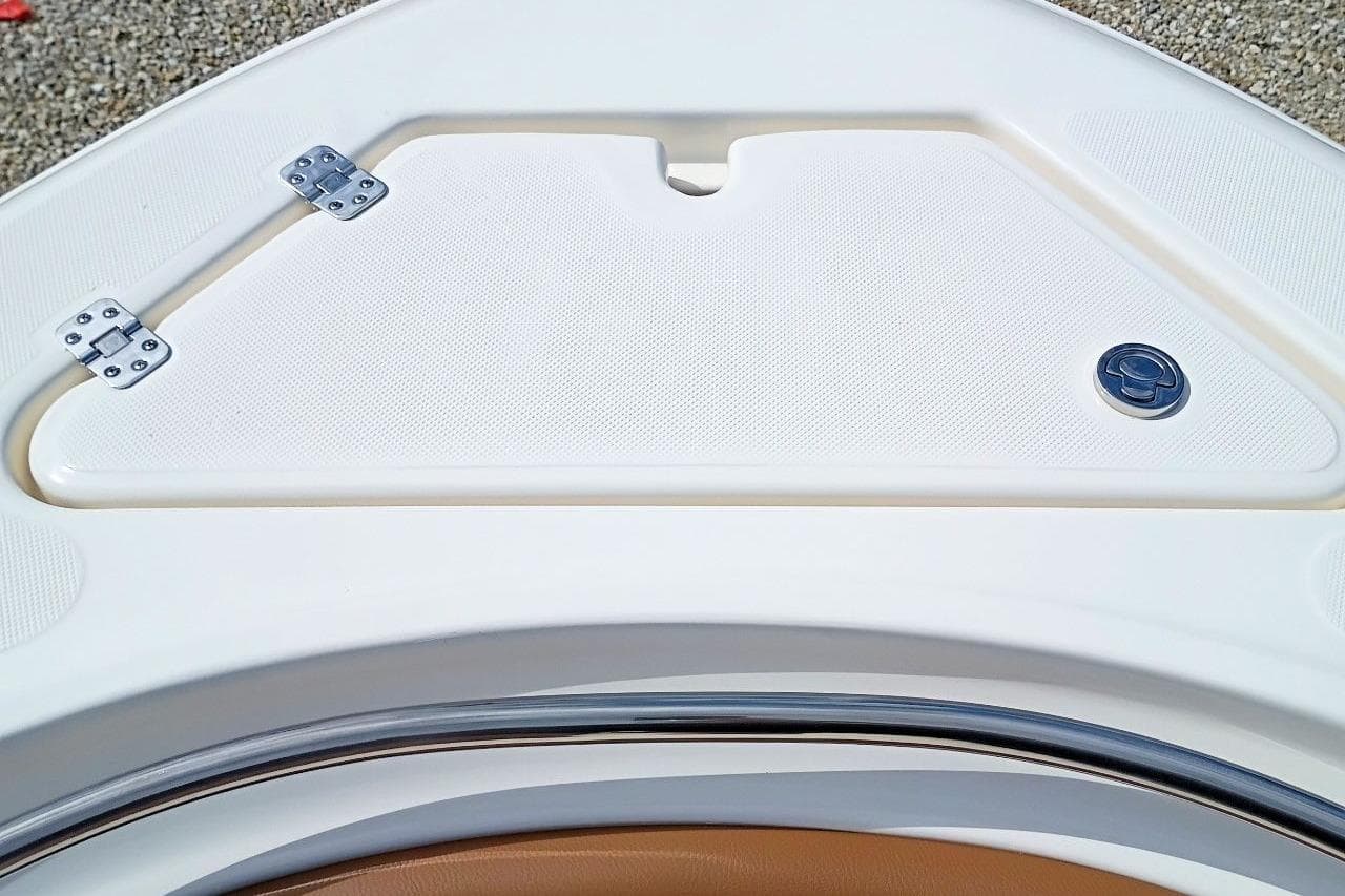 2027 Pioneer 222 Sportfish boat hatch with stainless steel hinges and latch.