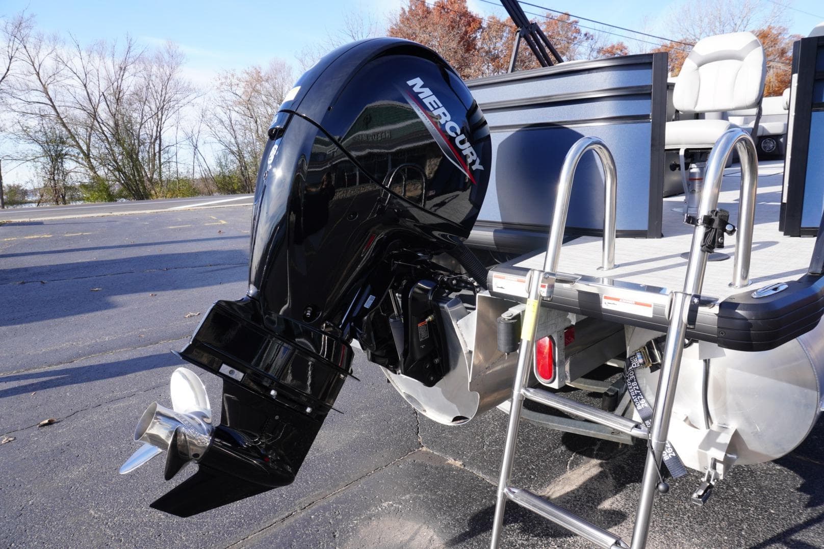 2026 Viaggio Lago V-R boat with Mercury outboard motor and ladder.