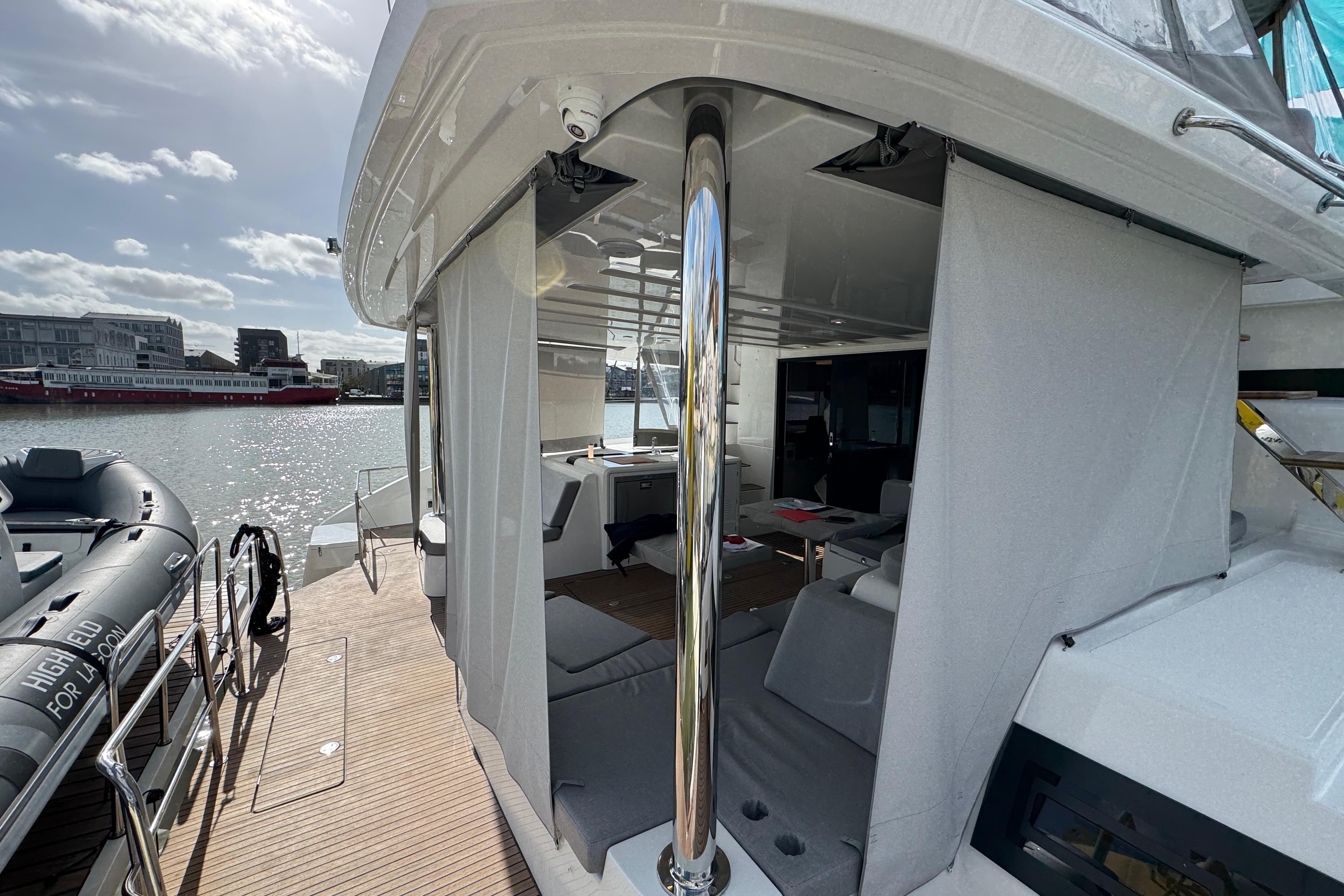 Luxurious 2026 Lagoon 55 yacht interior with modern design and waterfront view.