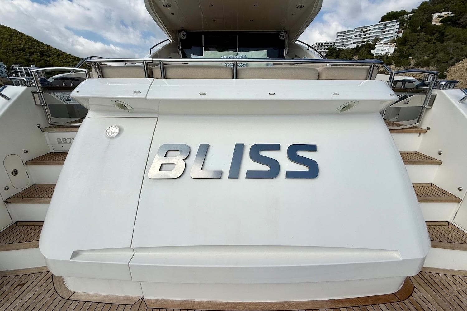 Luxury yacht "Bliss" stern view, Princess V72 model, 2015, docked with scenic backdrop.
