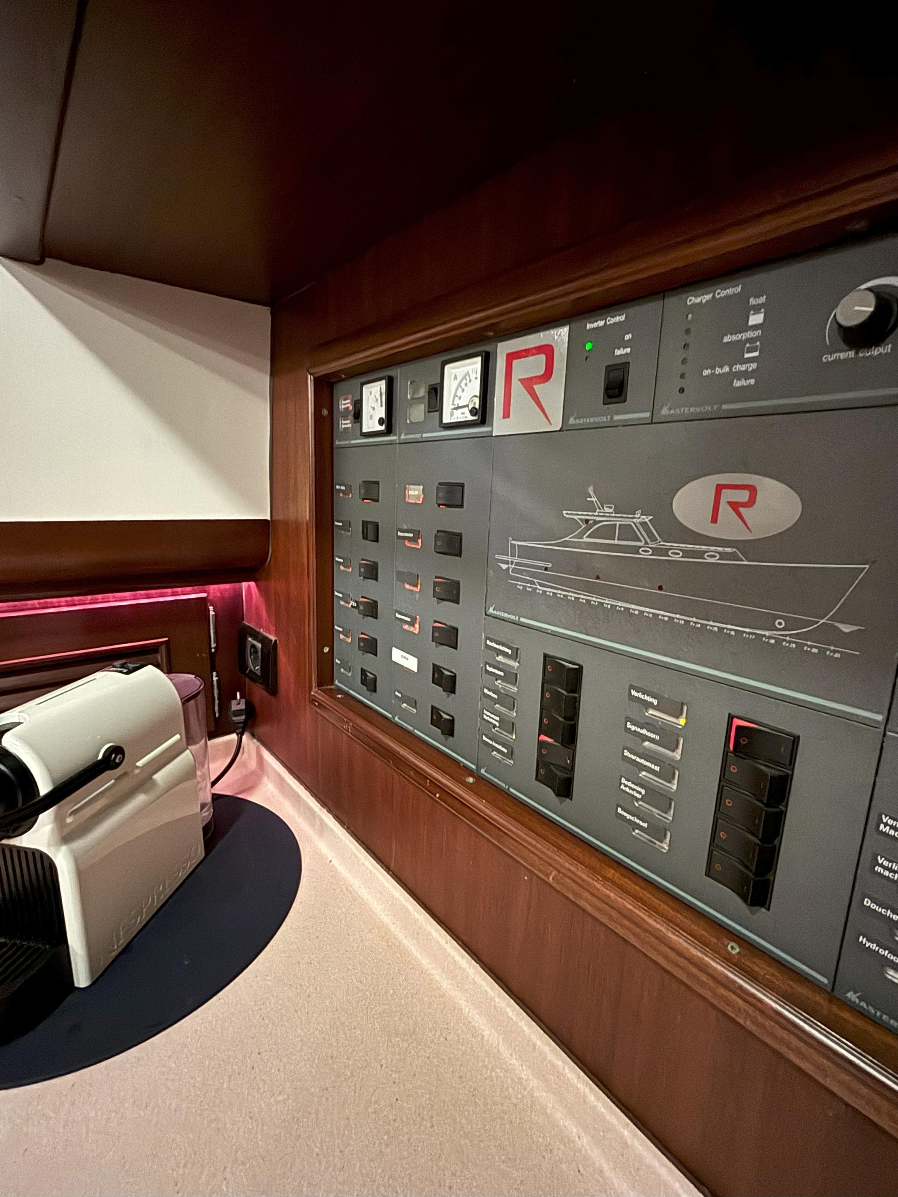 Control panel of a 2003 Rapsody 48 yacht, featuring switches and gauges.