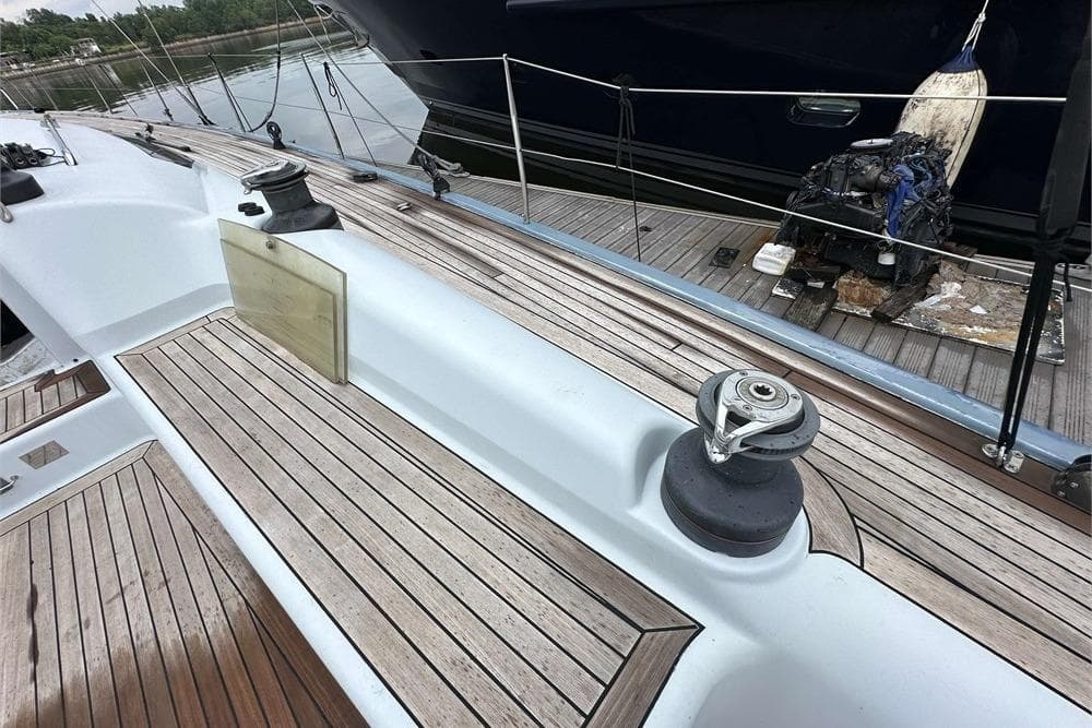 Deck of 2005 Simonis Voogd 56 yacht with wooden finish and winch.