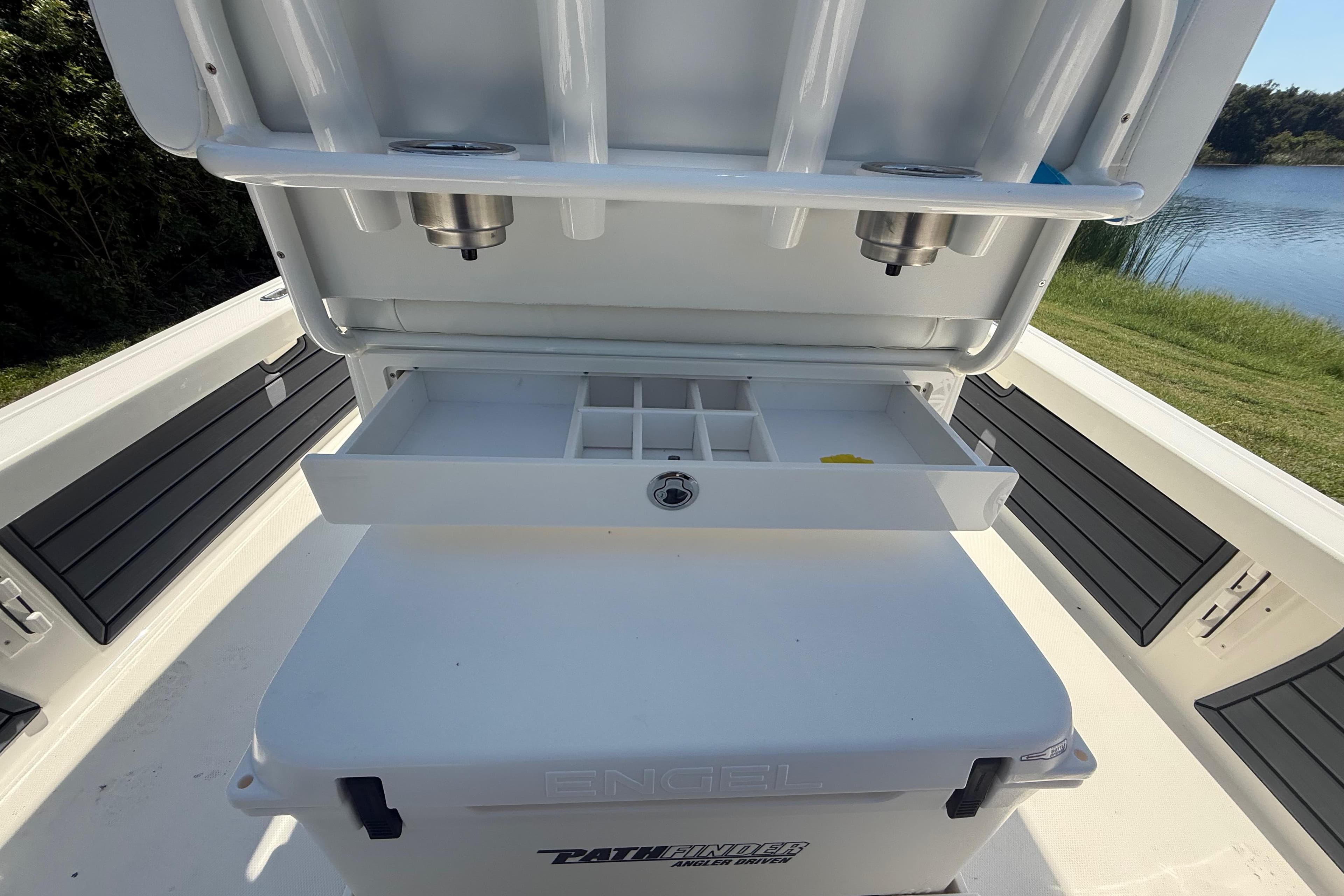 2026 Pathfinder 2200 TRS boat with open storage compartment and tackle organizer.