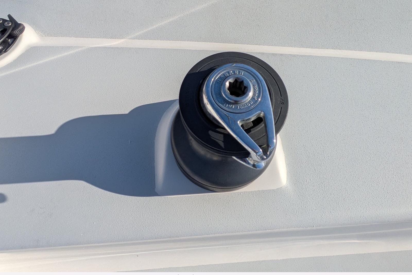 Winch on 2008 JPK 110 sailboat deck, featuring sleek design and durable construction.
