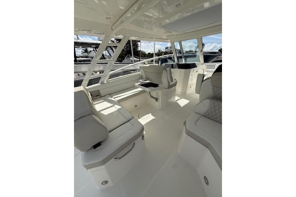 Luxurious interior of 2026 World Cat 400 DC-X Island boat with plush seating.