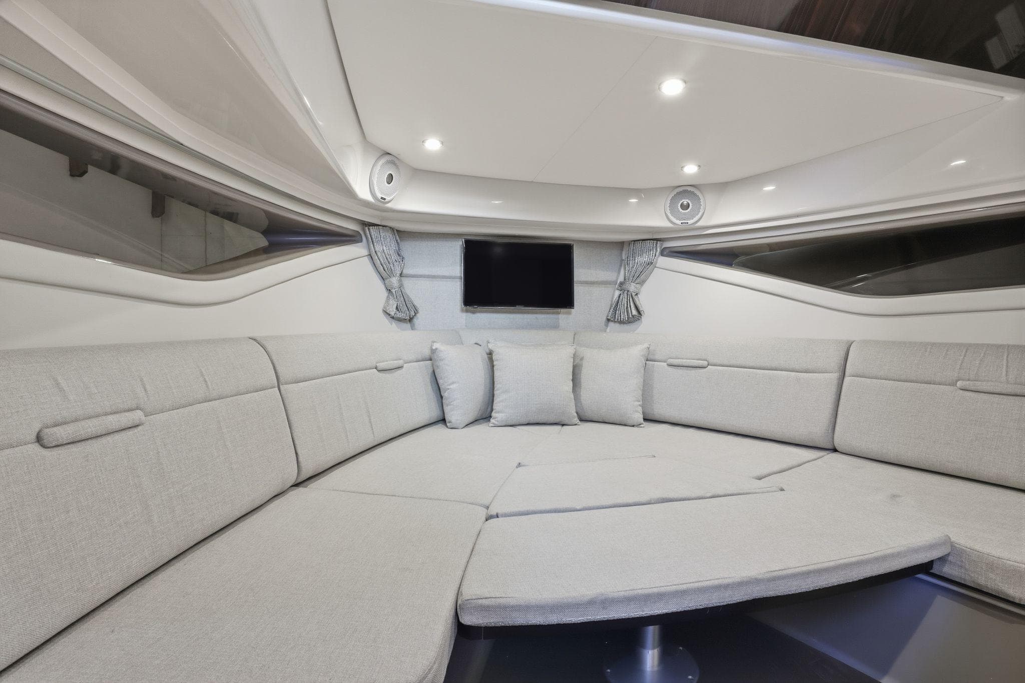 Luxurious interior of 2019 Sea Ray Sundancer 320 yacht with plush seating and modern amenities.