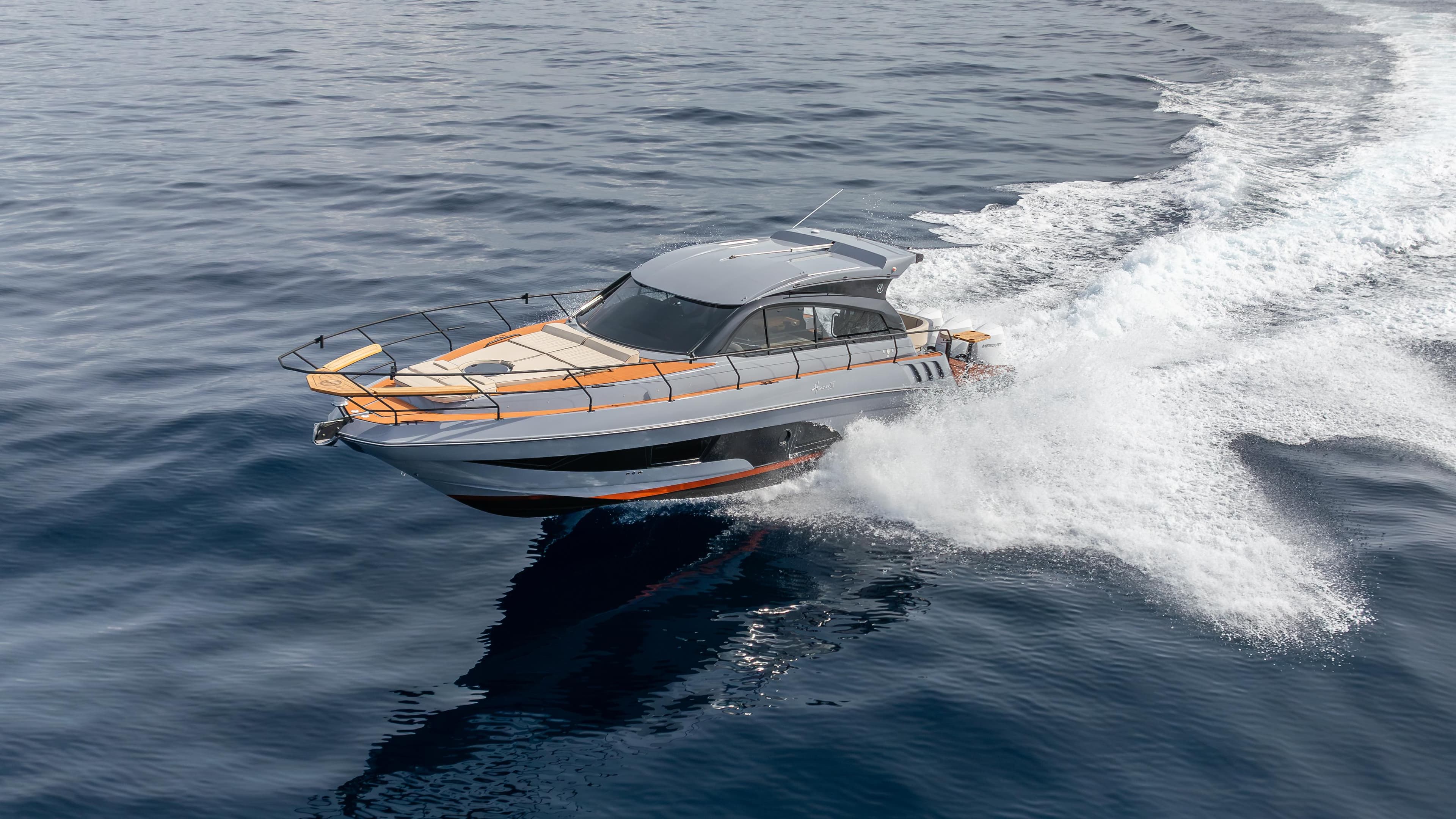 2025 Hanover 415 yacht cruising swiftly on open water.