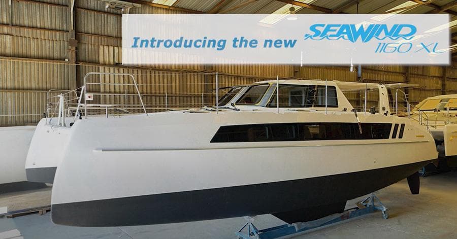Introducing the 2025 Seawind 1160 XL catamaran in a boatyard setting.