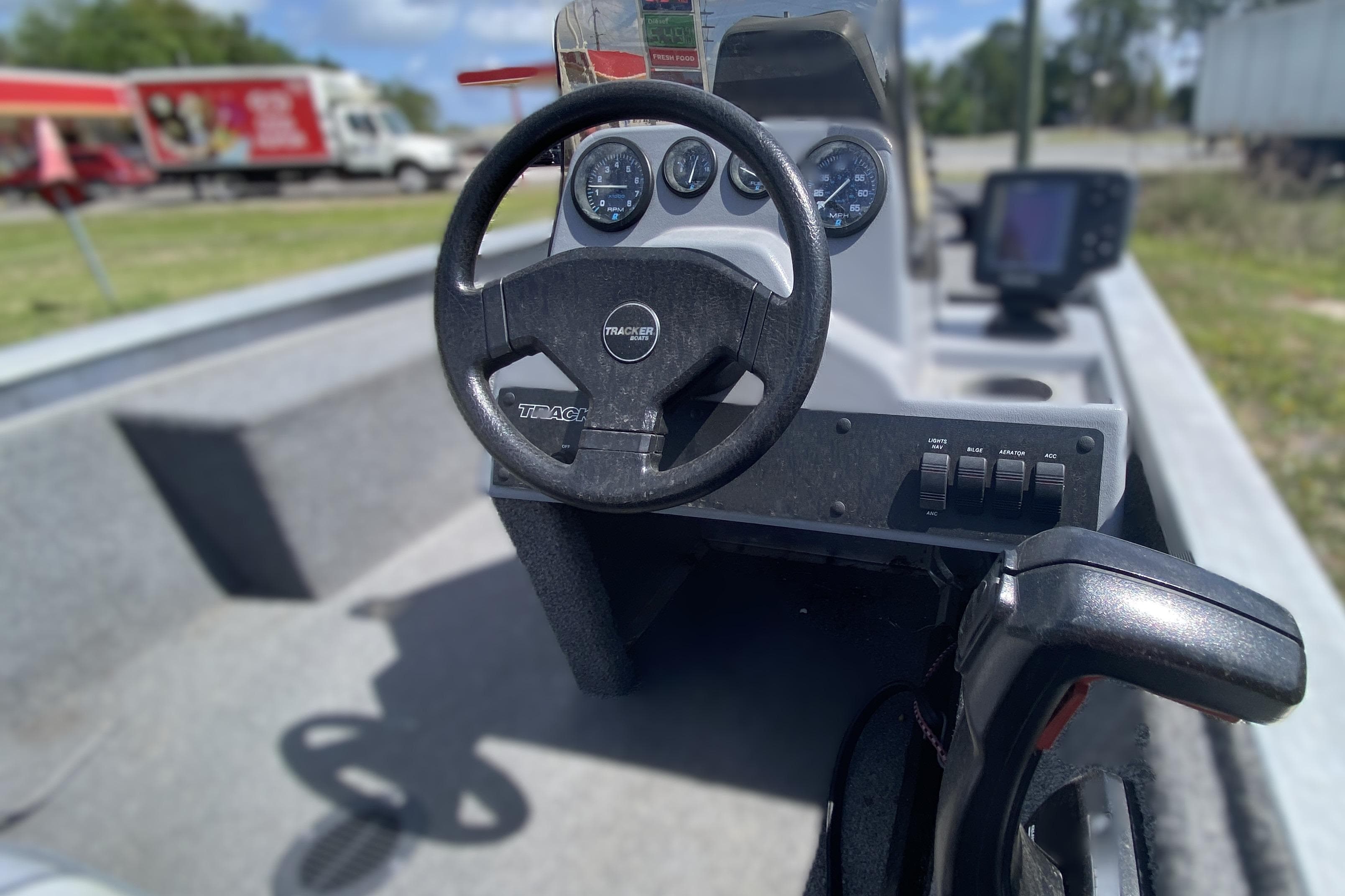 1994 Tracker Pro Guide V-17 SC boat interior with steering wheel and control panel.