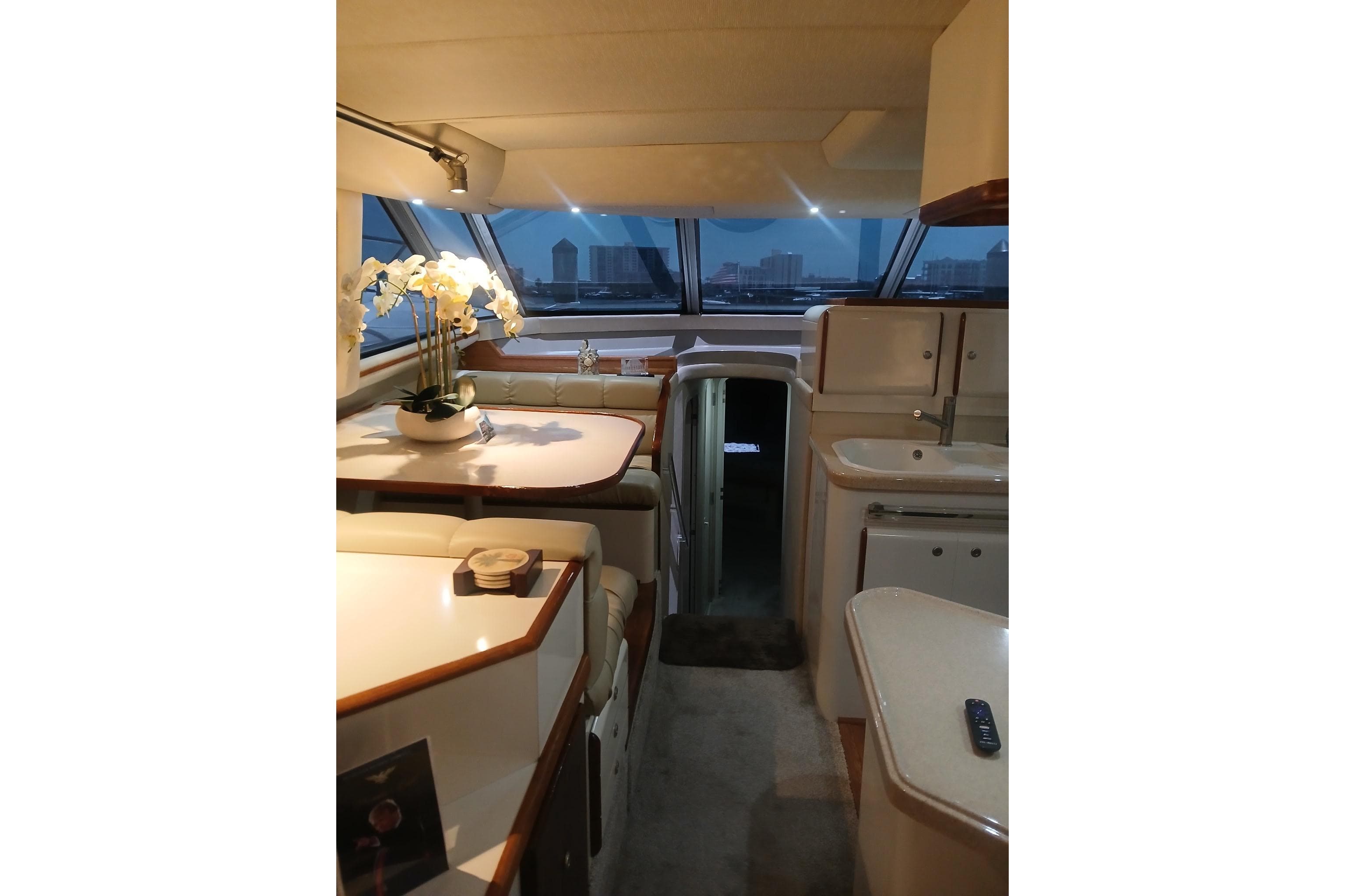 Luxurious interior of 1996 Sea Ray 550 Sedan Bridge yacht with elegant dining area.