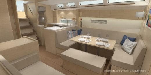 Luxurious interior of 2025 X-Yachts X-4.9 with elegant oak furniture and modern dining area.