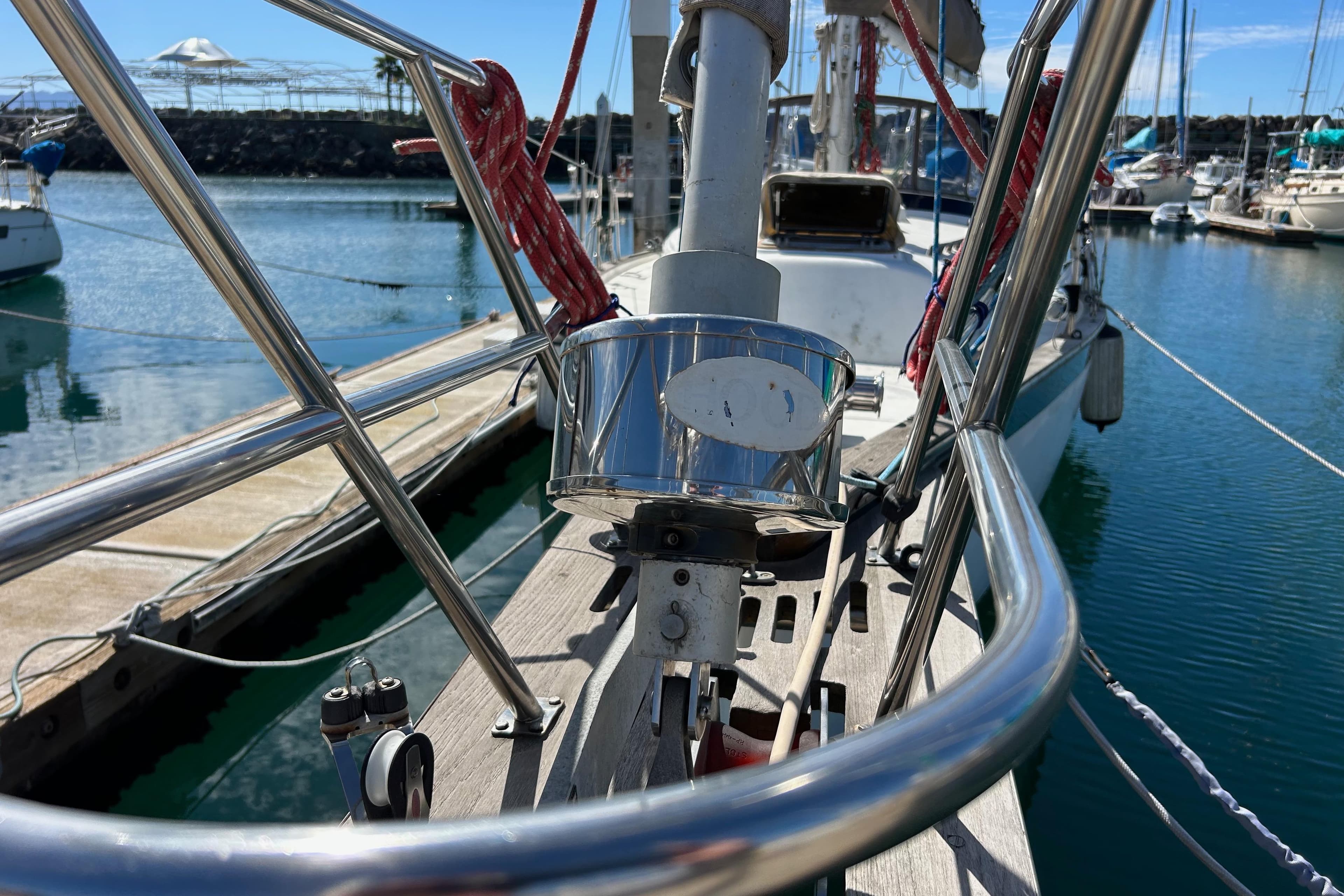 Bow view of 1982 Endeavour 37 sailboat docked in a marina.