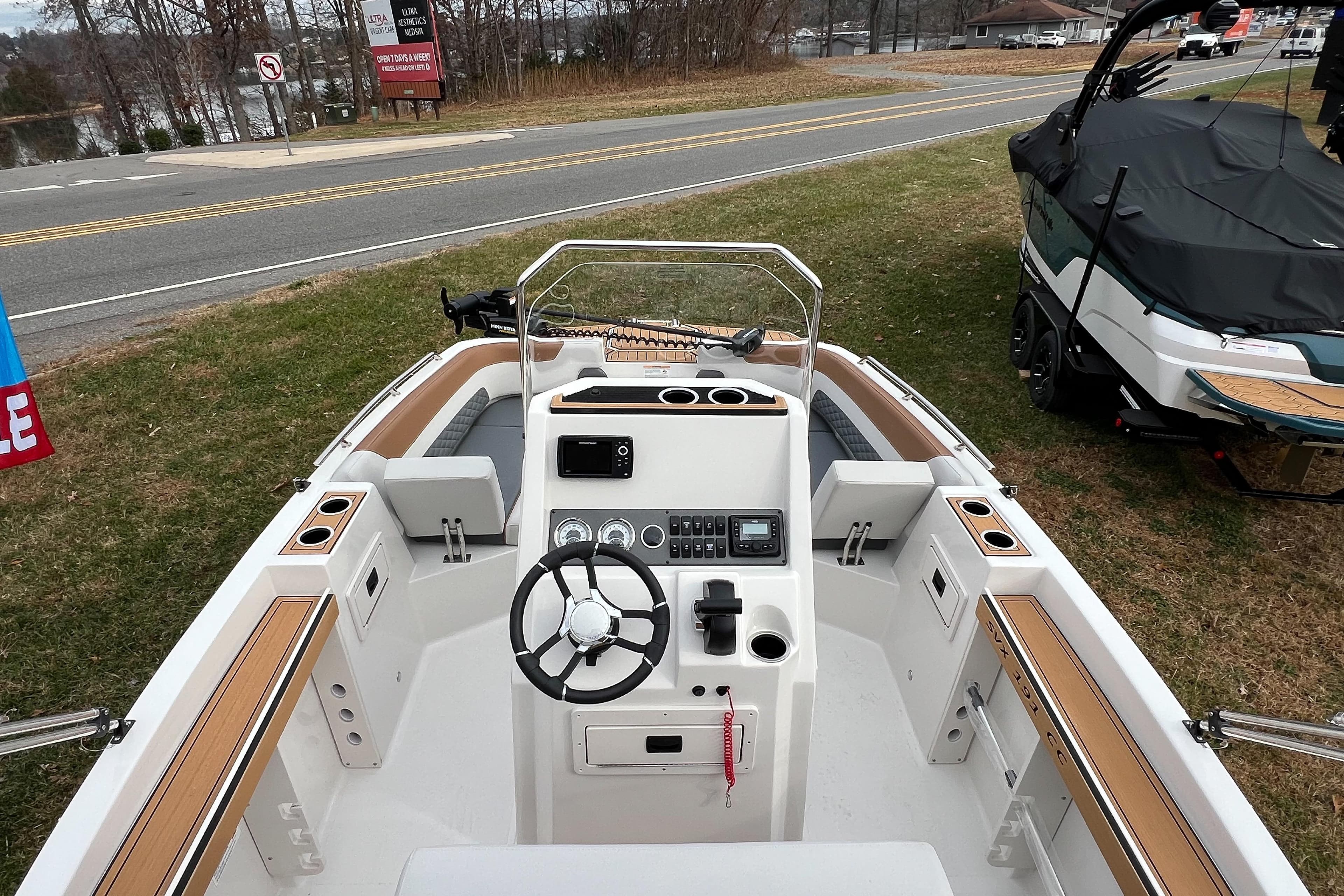 2026 Starcraft SVX 191 OB CC boat interior with steering wheel and control panel.