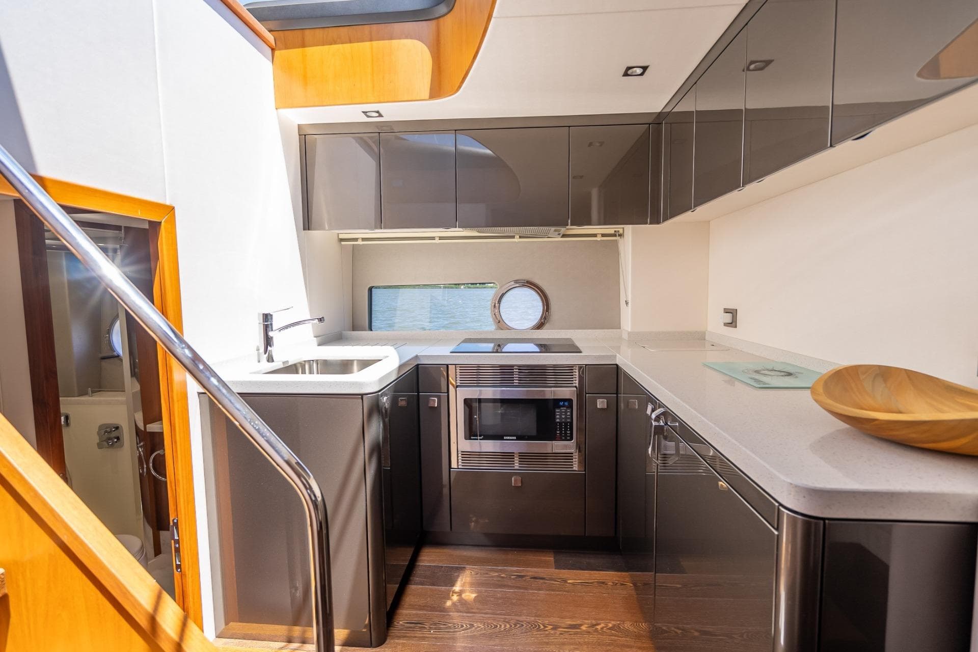 Luxurious kitchen interior of 2018 Sunseeker Predator 57 yacht with modern appliances.