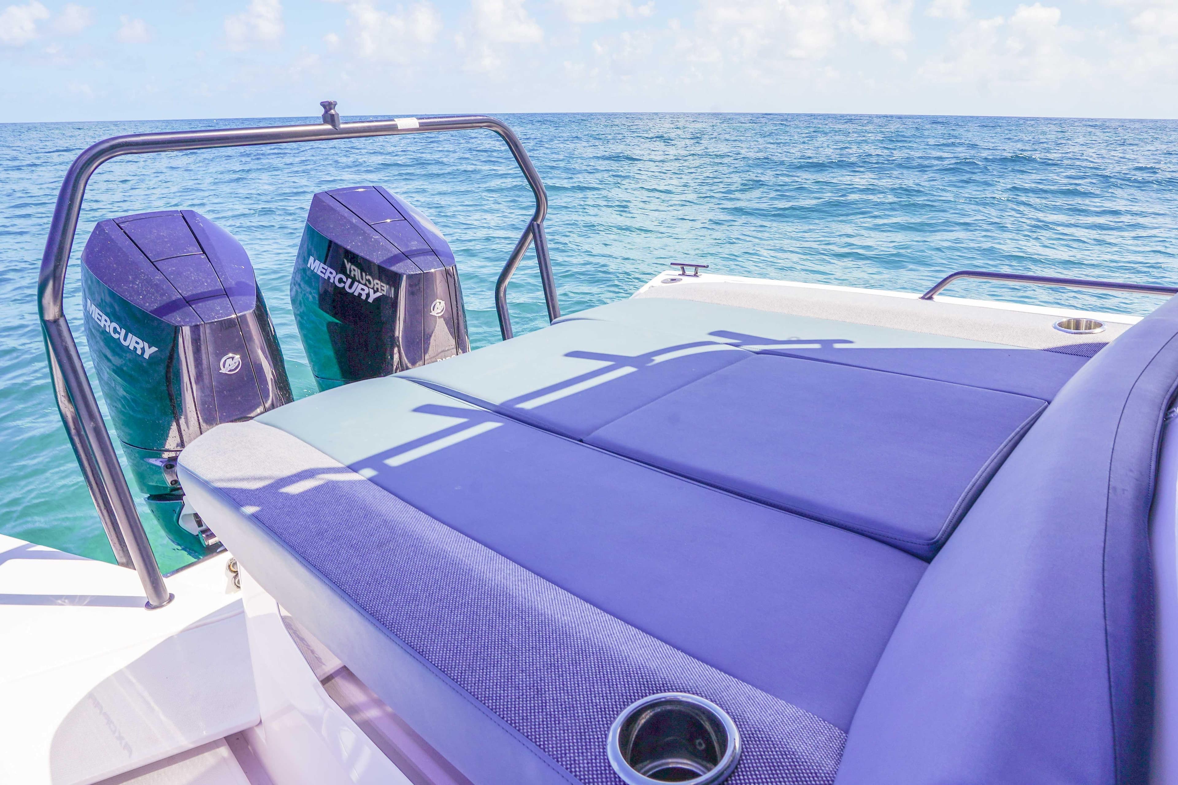 2024 Axopar 37 XC Cross Cabin with twin Mercury engines on open sea.