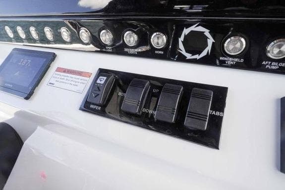 Control panel of 2023 Fountain 38 Tournament Edition boat with switches and display.