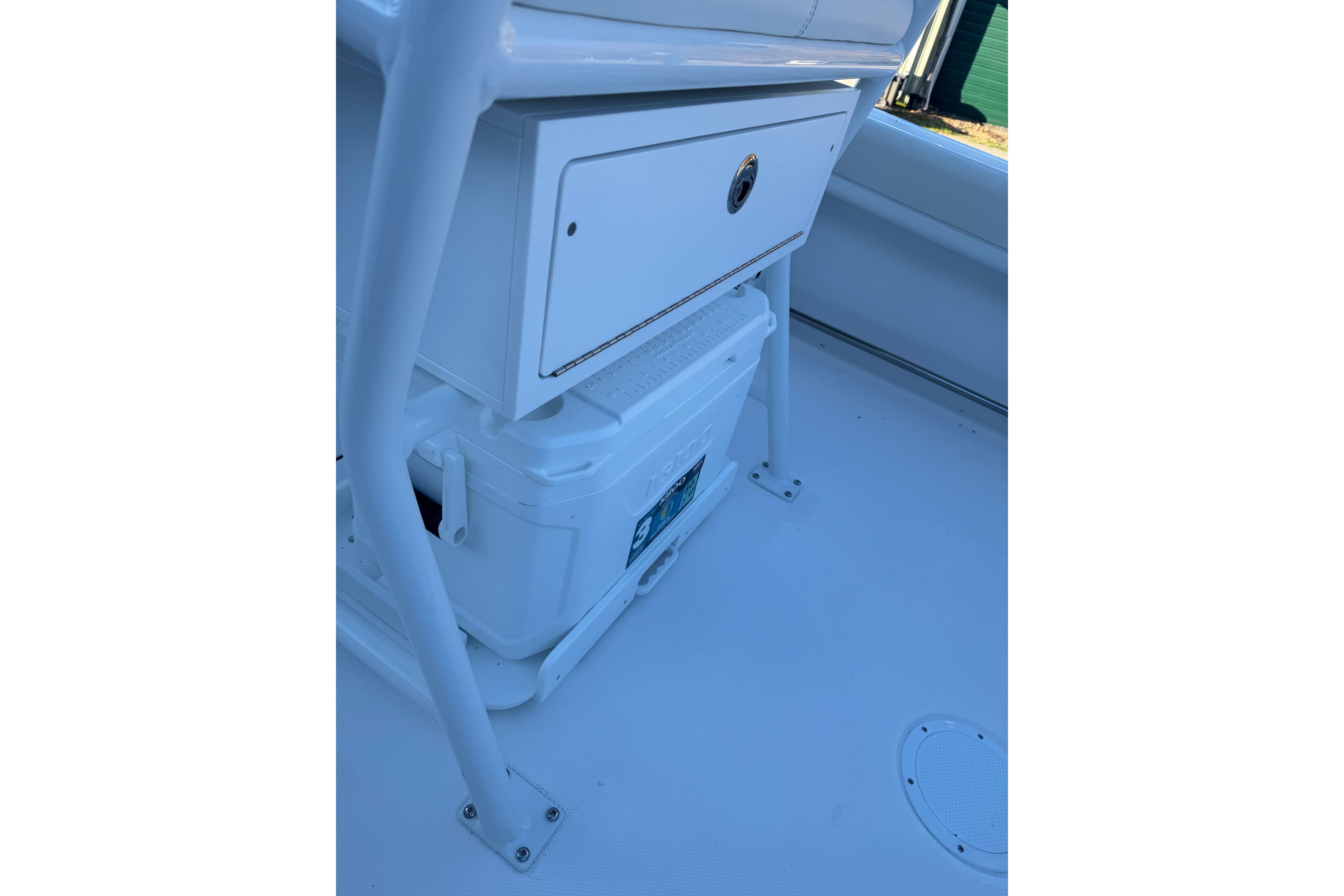 2026 Edgewater 208CC boat interior with storage compartment and cooler.
