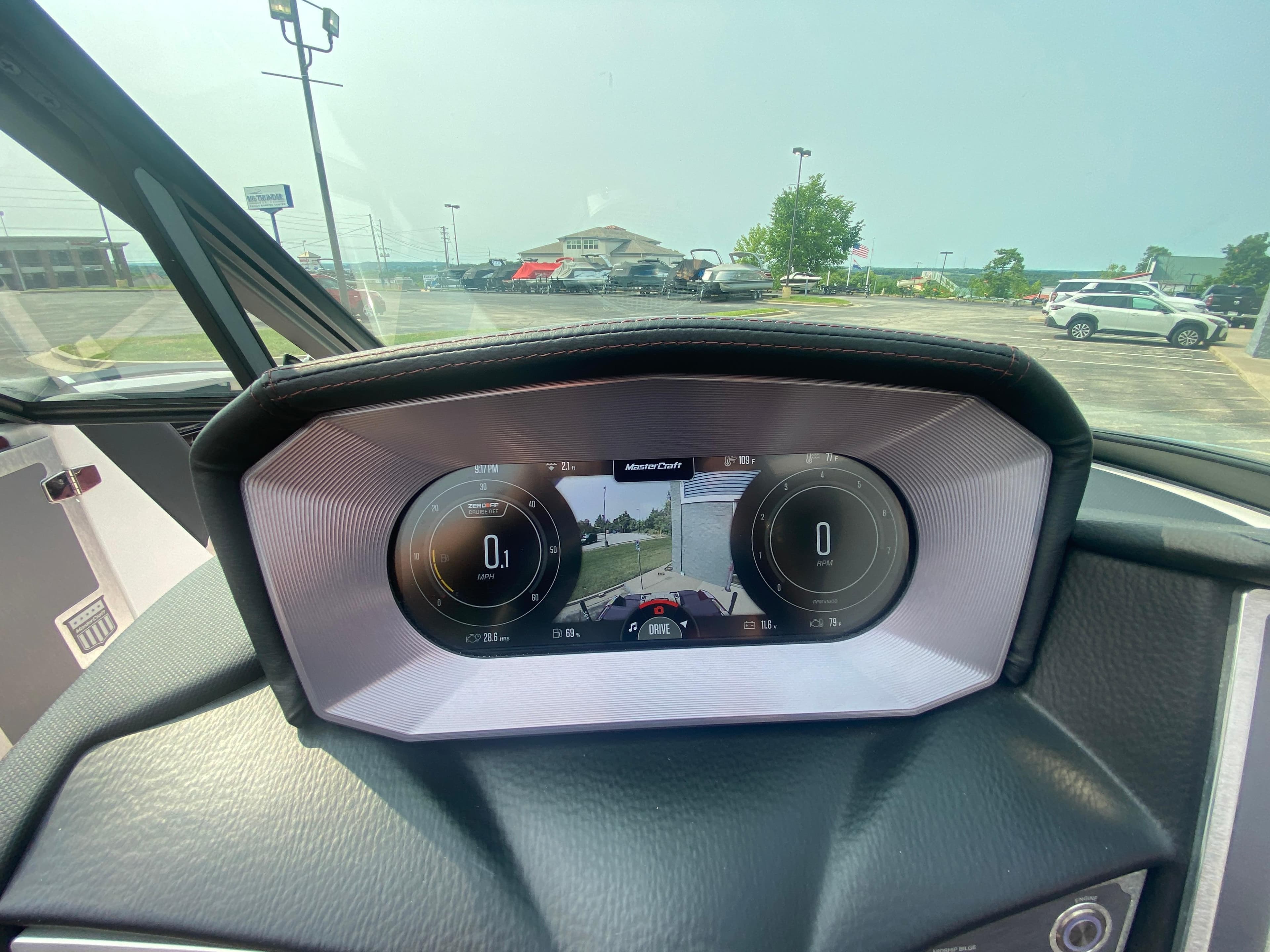 2022 MasterCraft X24 dashboard display with digital gauges and navigation screen.
