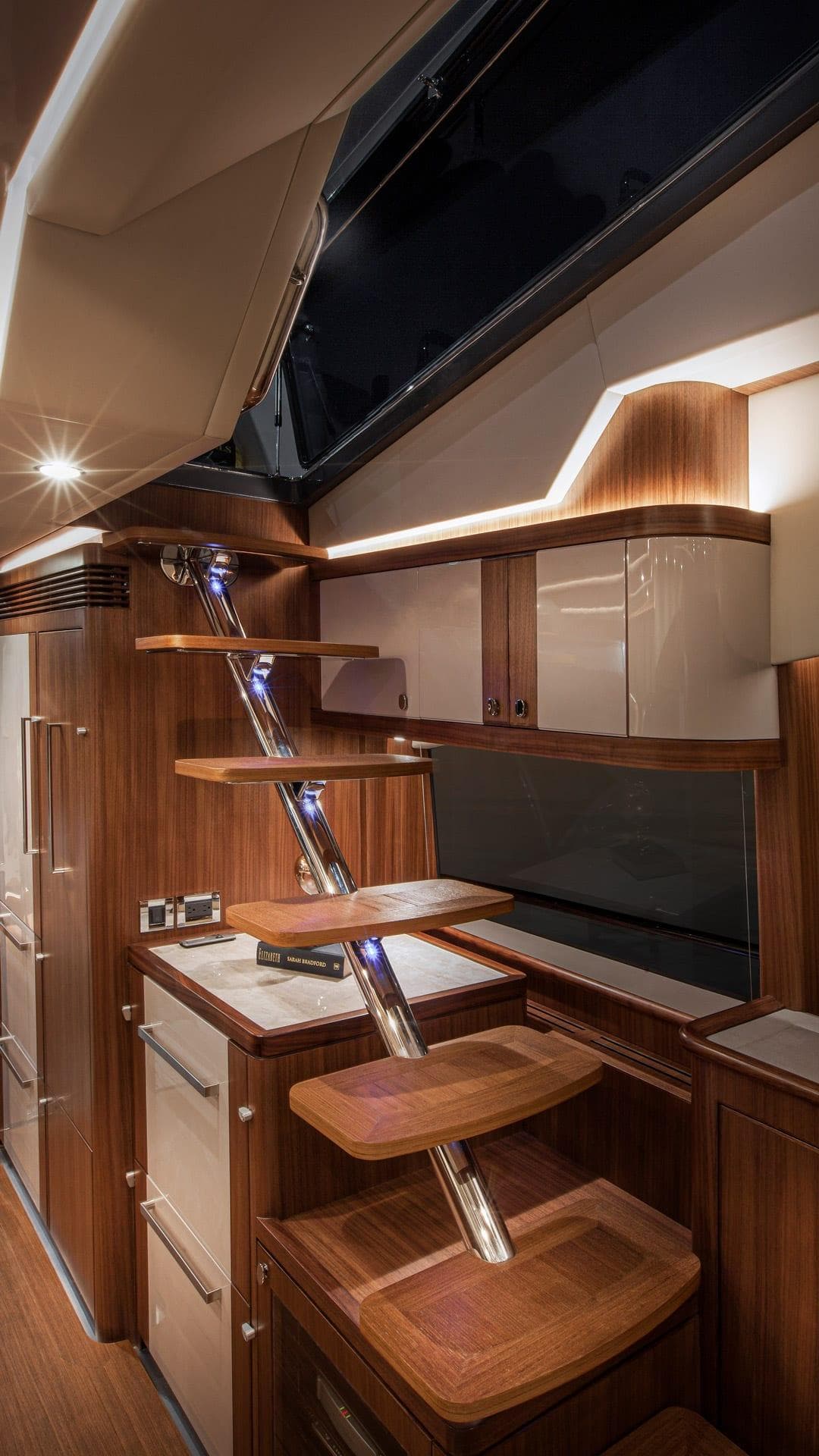 2024 Belize 66 Daybridge yacht interior with modern wooden cabinetry and sleek design.