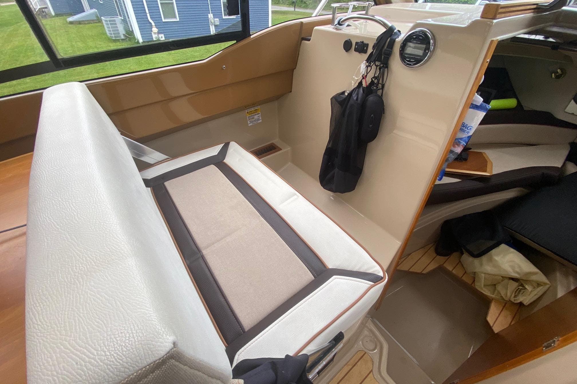 Interior of a 2016 Cutwater C-24 boat, featuring seating and storage areas.