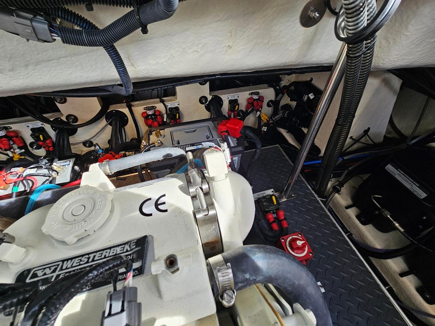 Engine compartment of 2023 Formula 350 Crossover Bowrider with visible wiring and components.