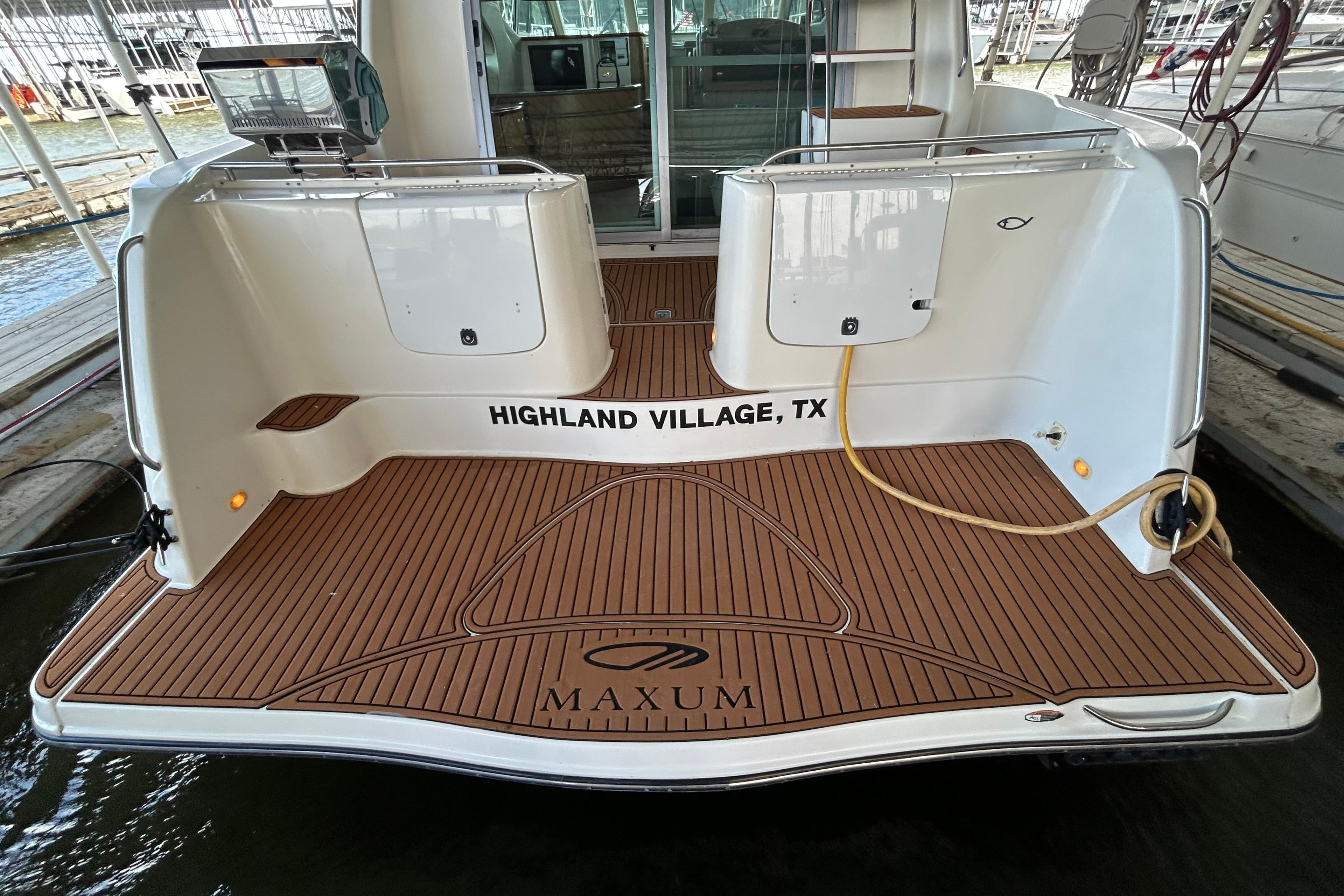1999 Maxum 4600 SCB yacht with teak deck, docked in Highland Village, TX.