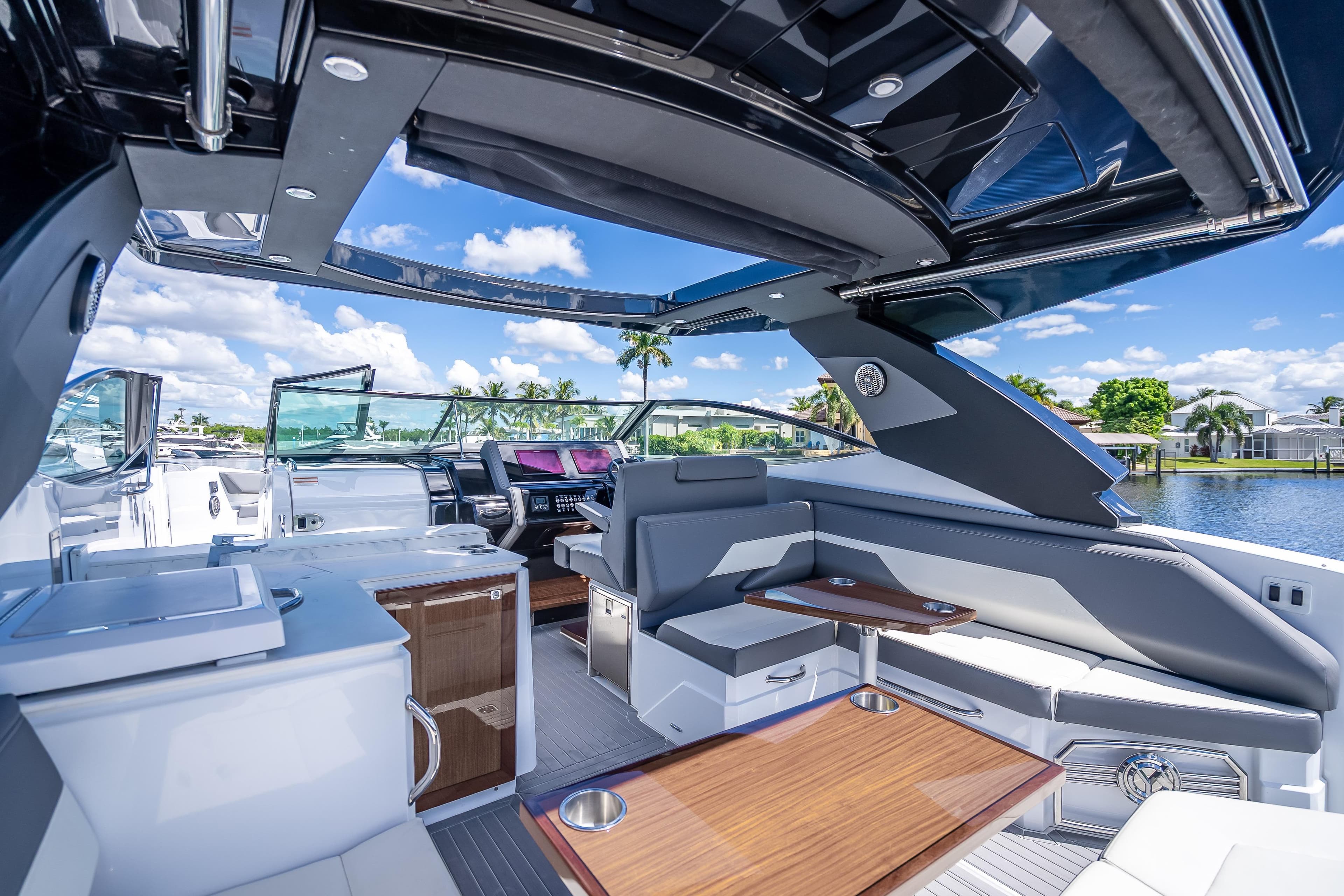 Luxurious 2022 Cruisers Yachts 38 GLS OB interior with sleek seating and modern amenities.