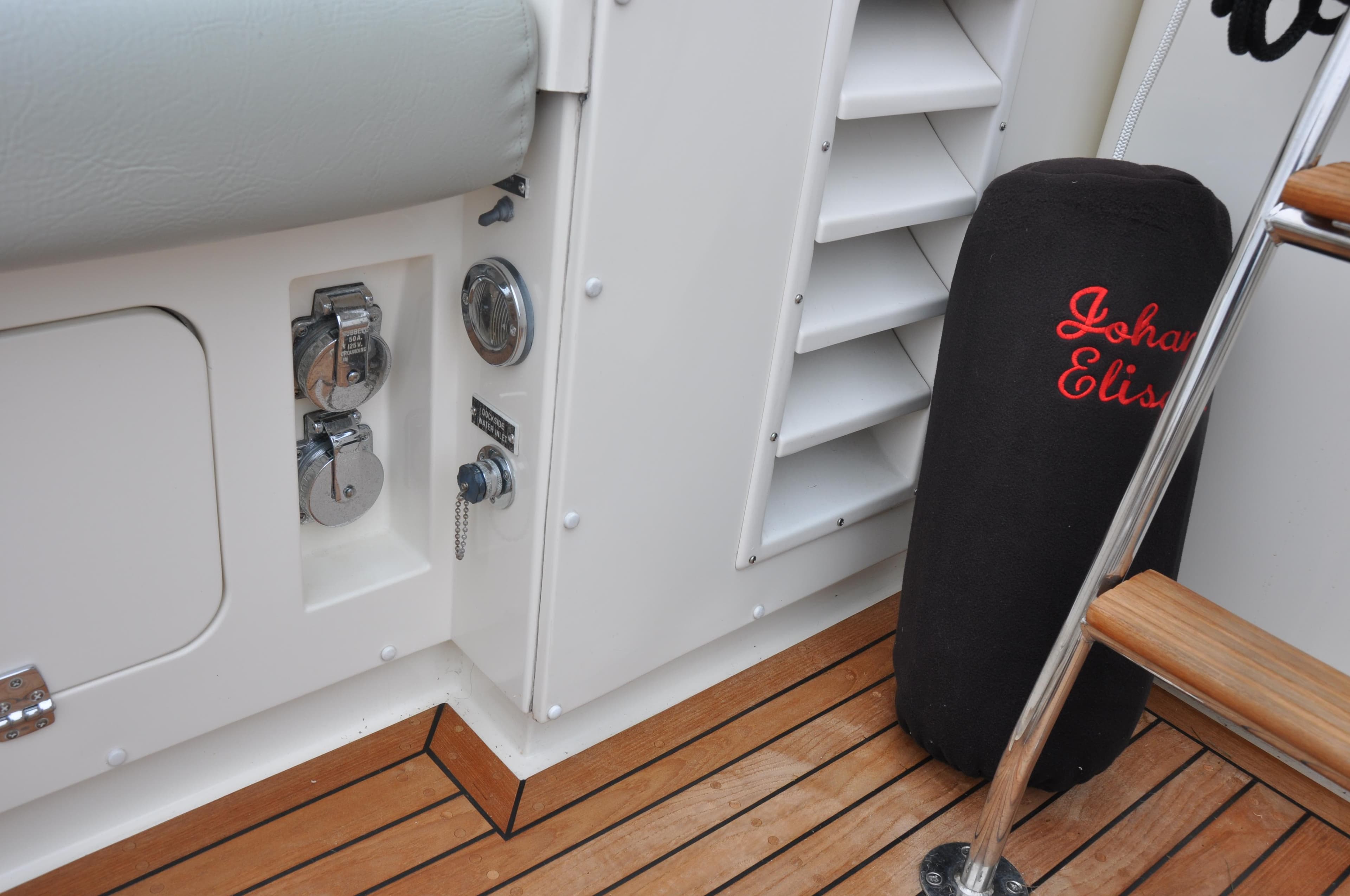 1987 Bertram 37 Convertible boat interior with teak flooring and equipment.