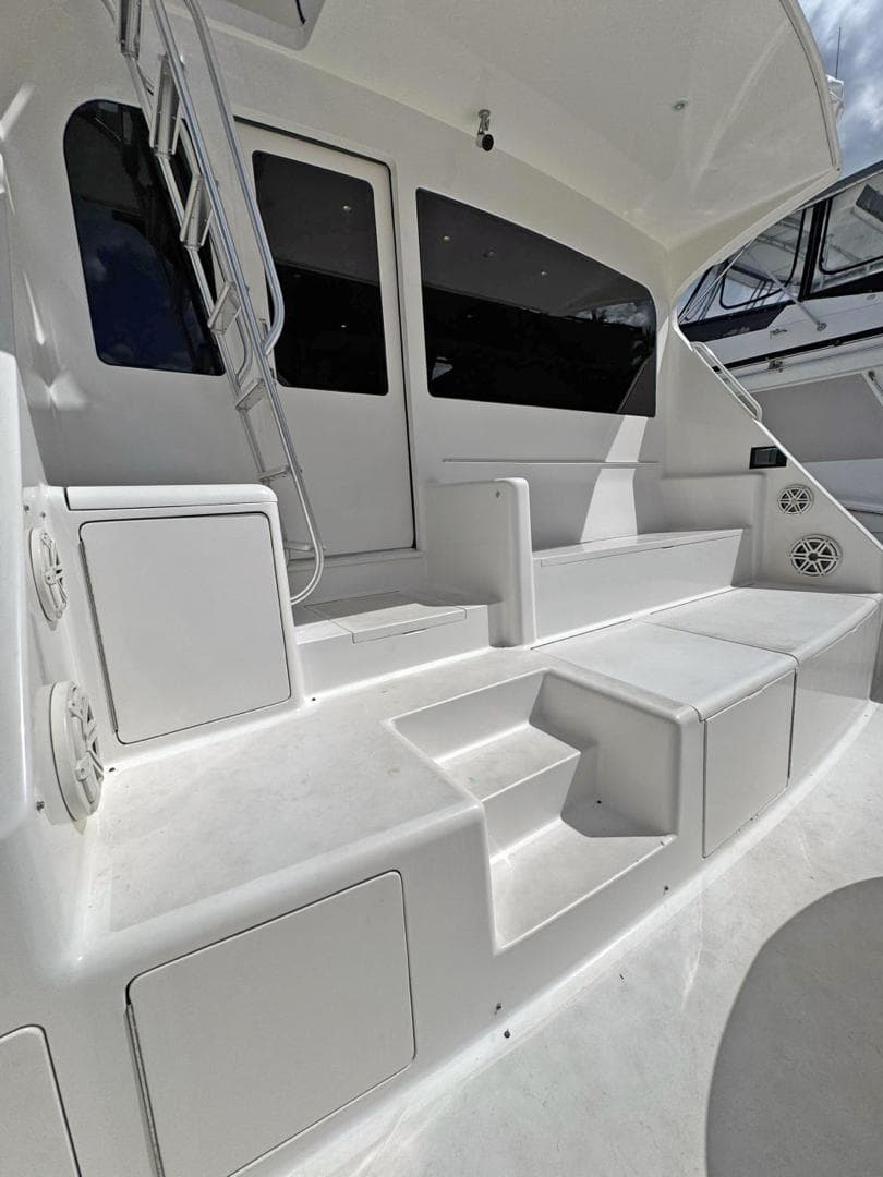 2008 Viking 68 Convertible yacht with white exterior and spacious deck area.