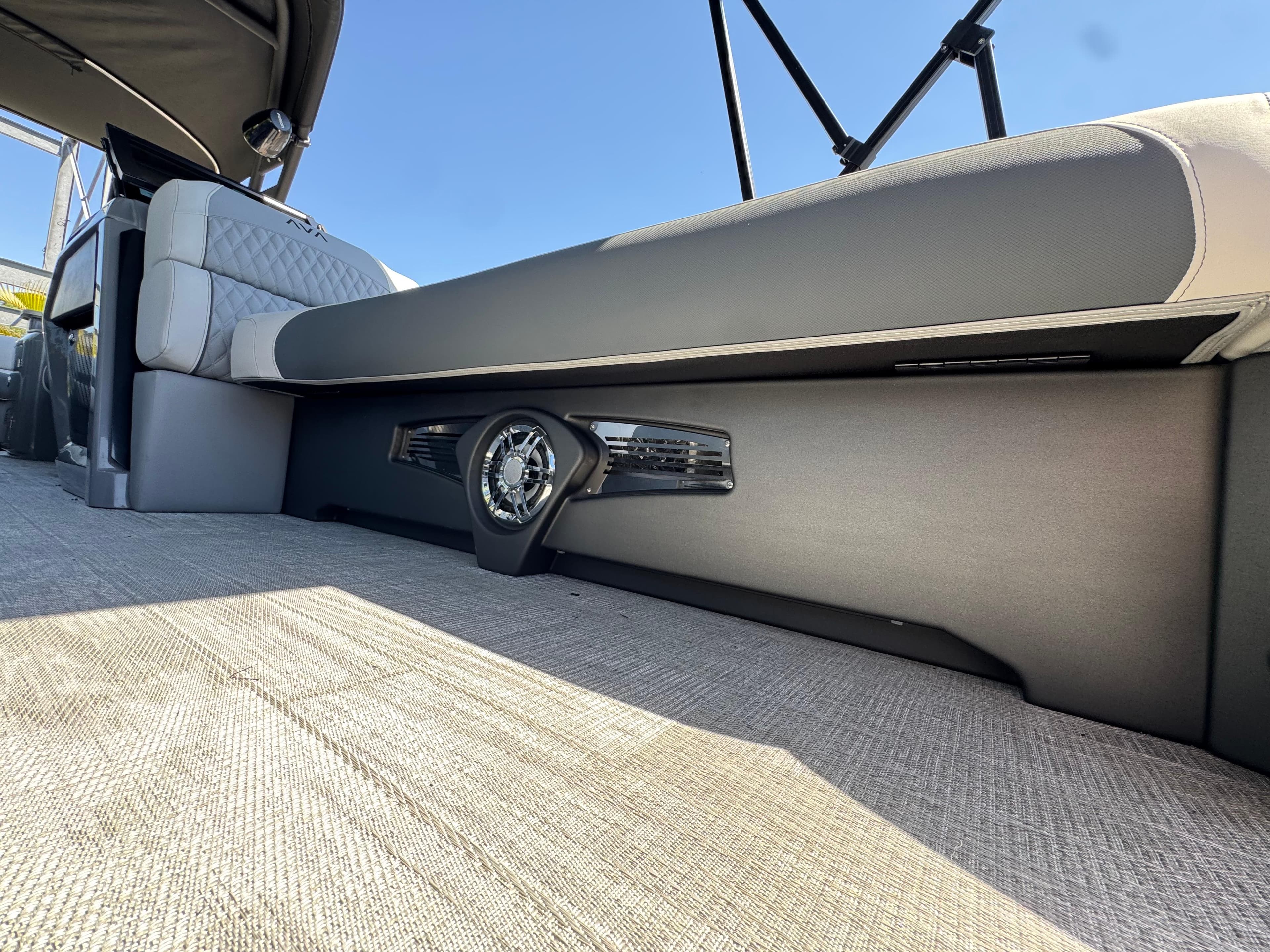 2025 Avalon Excalibur 27' boat interior with sleek seating and integrated speaker system.