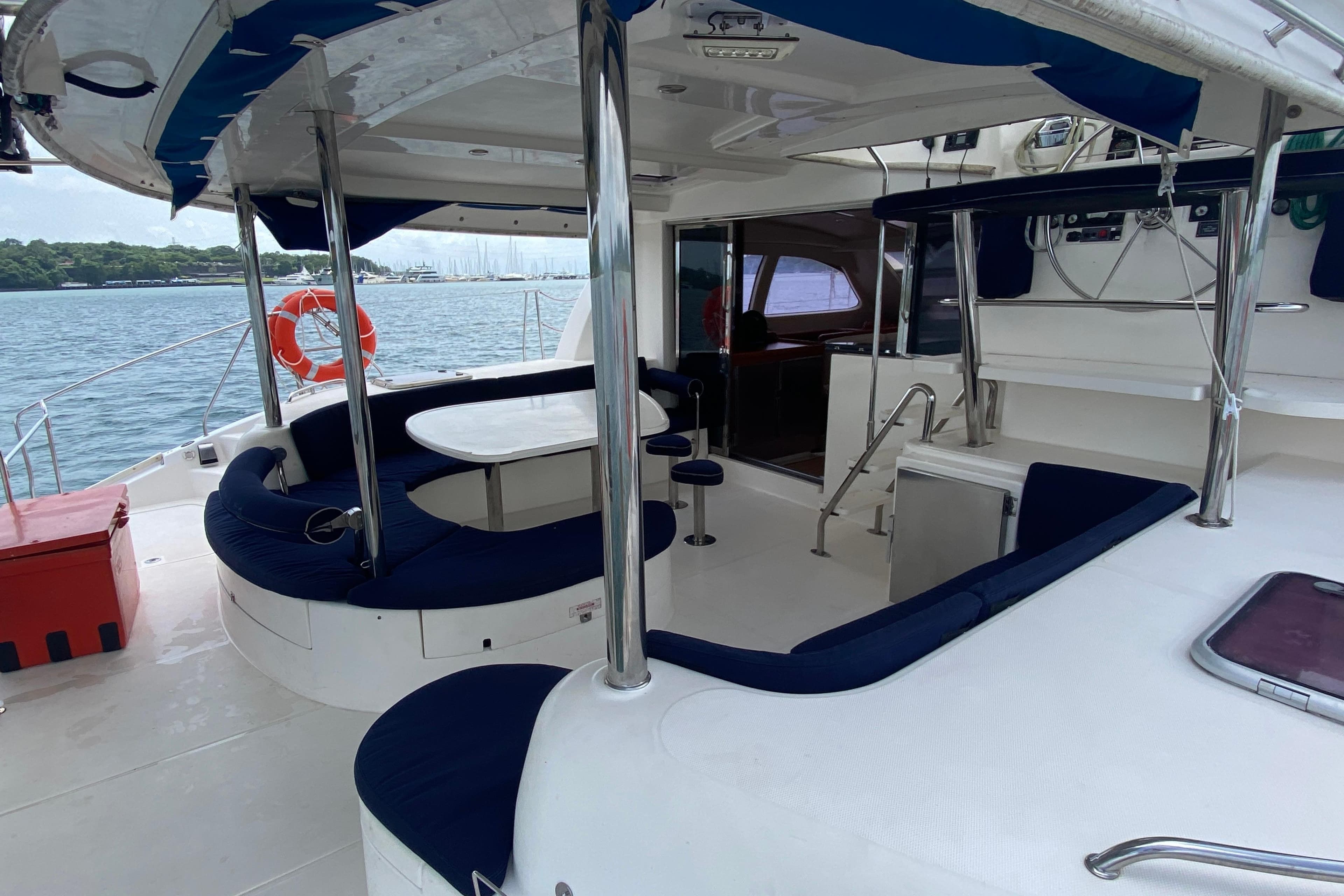 2010 Leopard 46 yacht interior with seating, table, and ocean view.