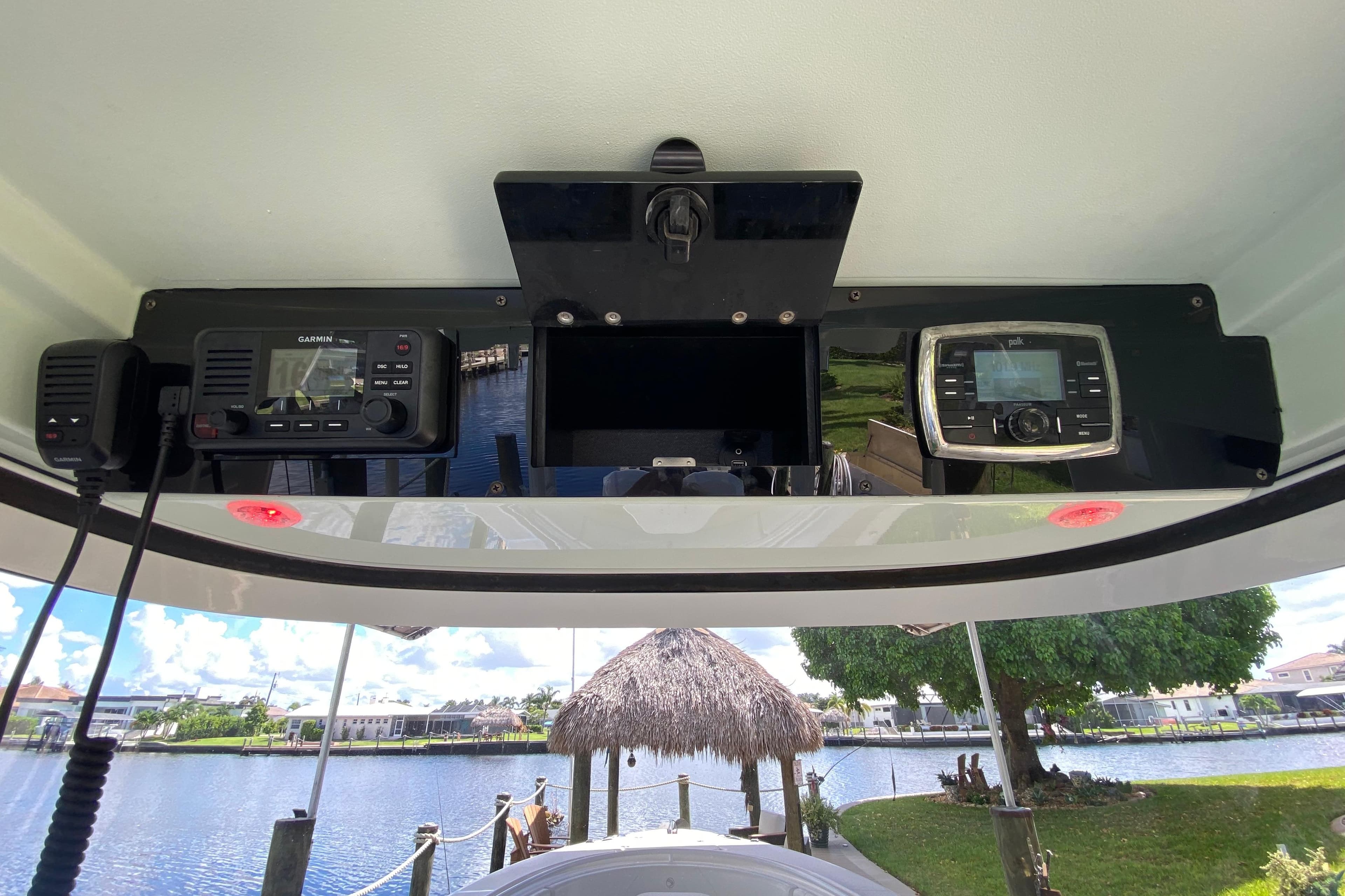 2015 Edgewater 320CC boat dashboard with Garmin and Polk audio systems.