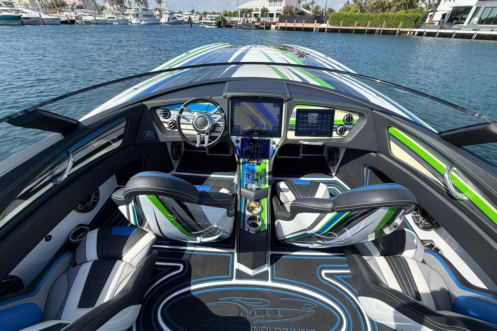 Interior view of 2022 MTI 390X boat with modern dashboard and seating.