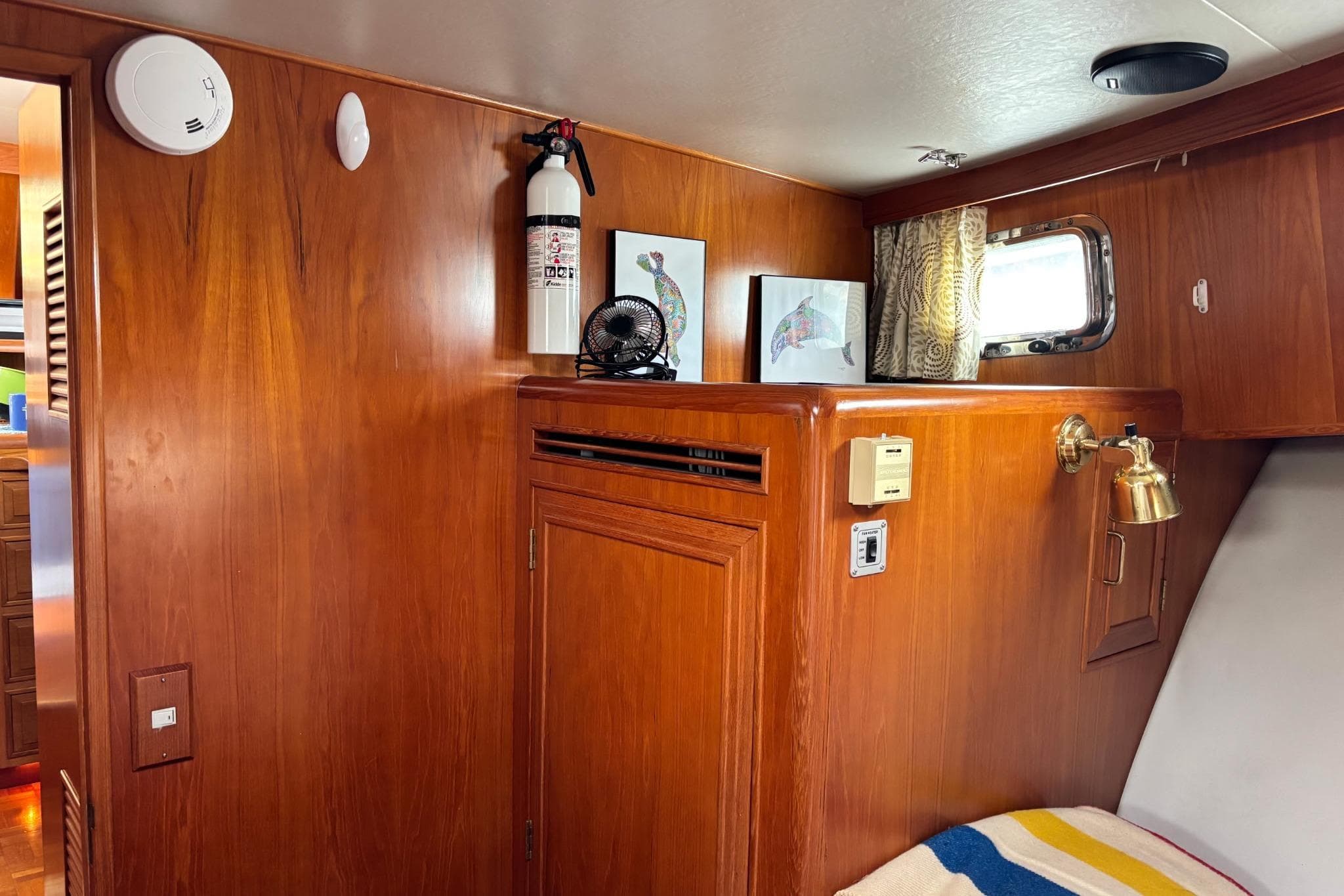 Interior of 1992 Ocean Alexander 456 Classicco with wood paneling and nautical decor.