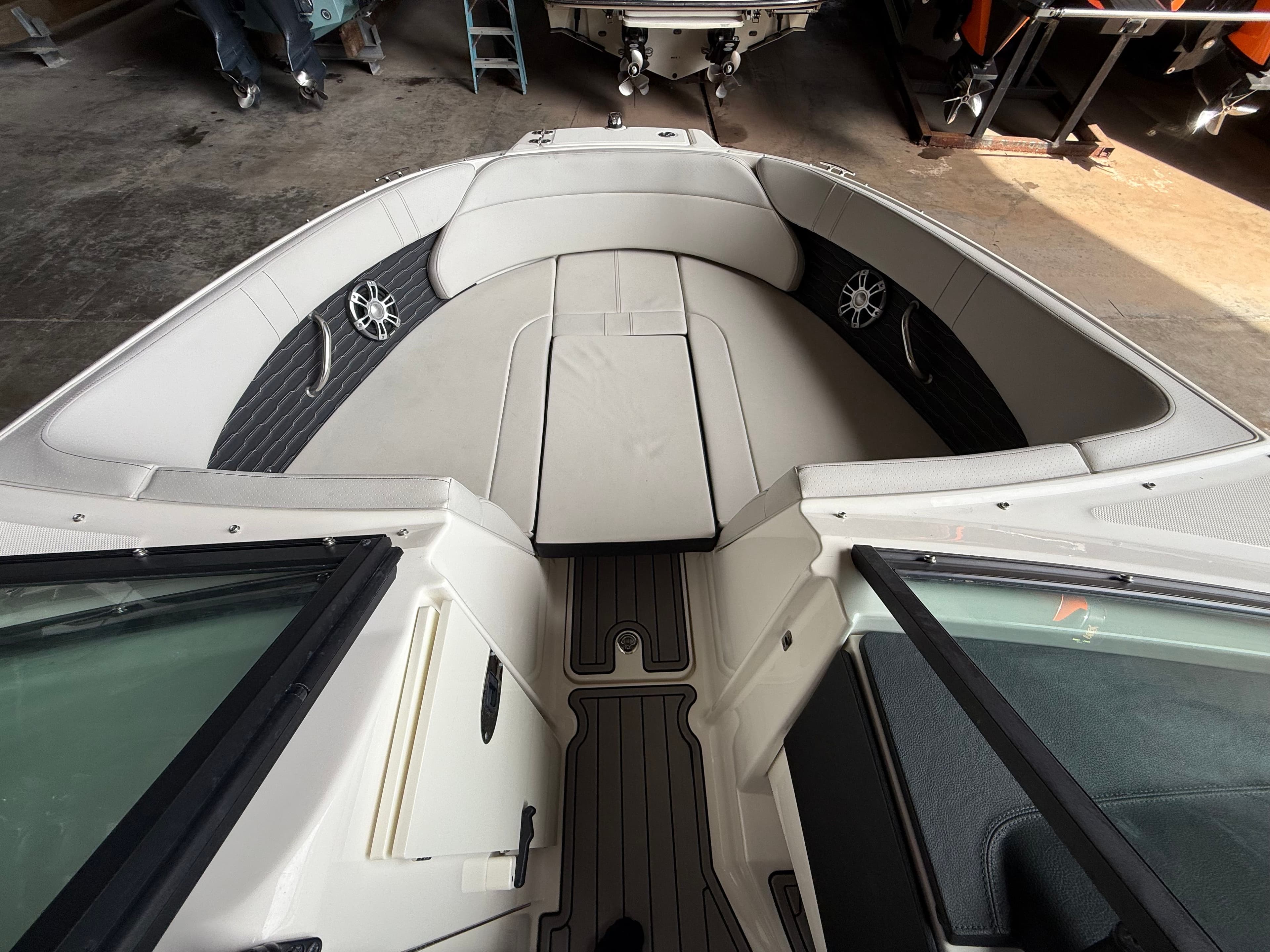 Interior of 2023 Sea Ray 23 SPX OB with gray upholstery.