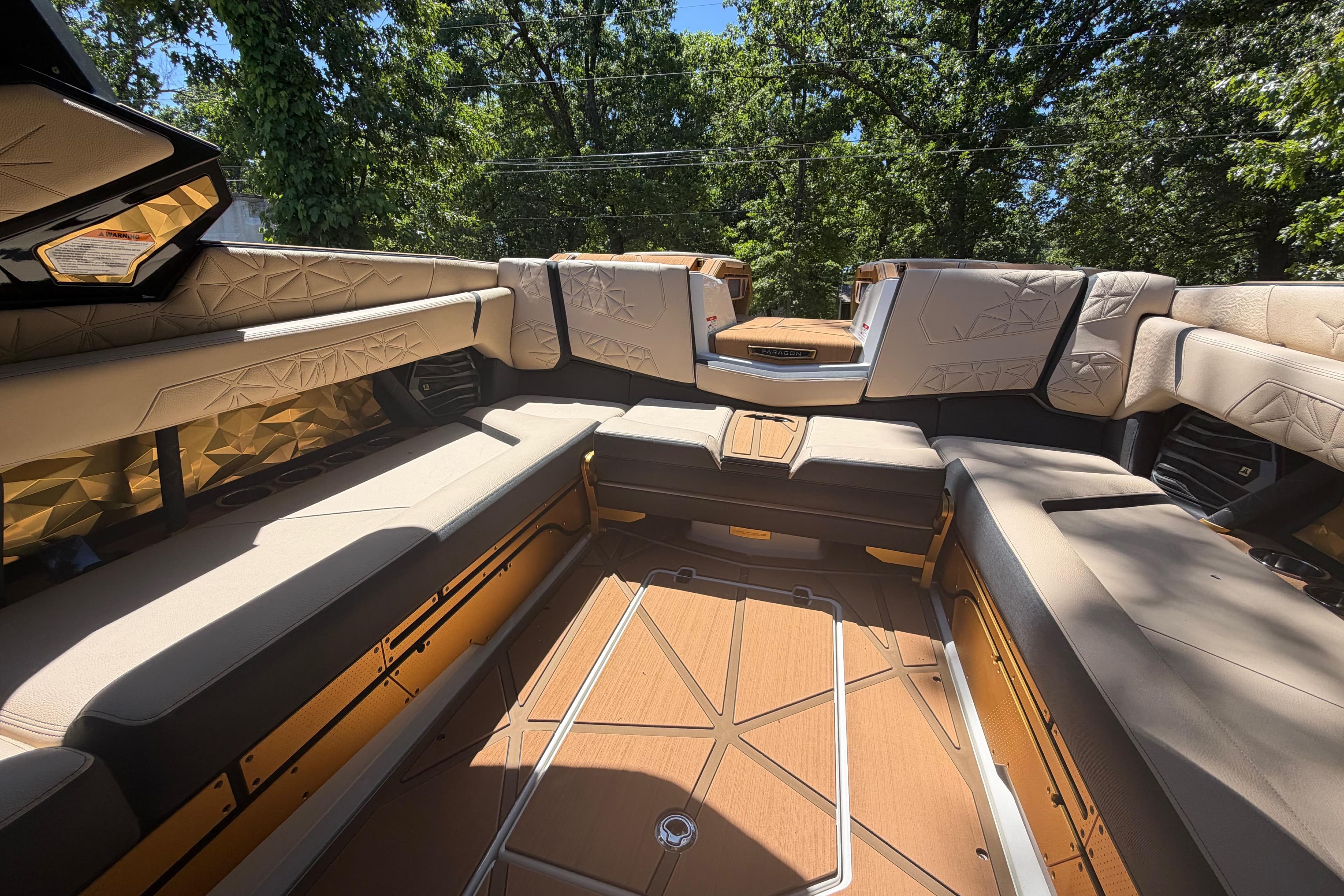 Luxurious interior of 2026 Nautique Super Air Nautique G25 Paragon boat, featuring plush seating.