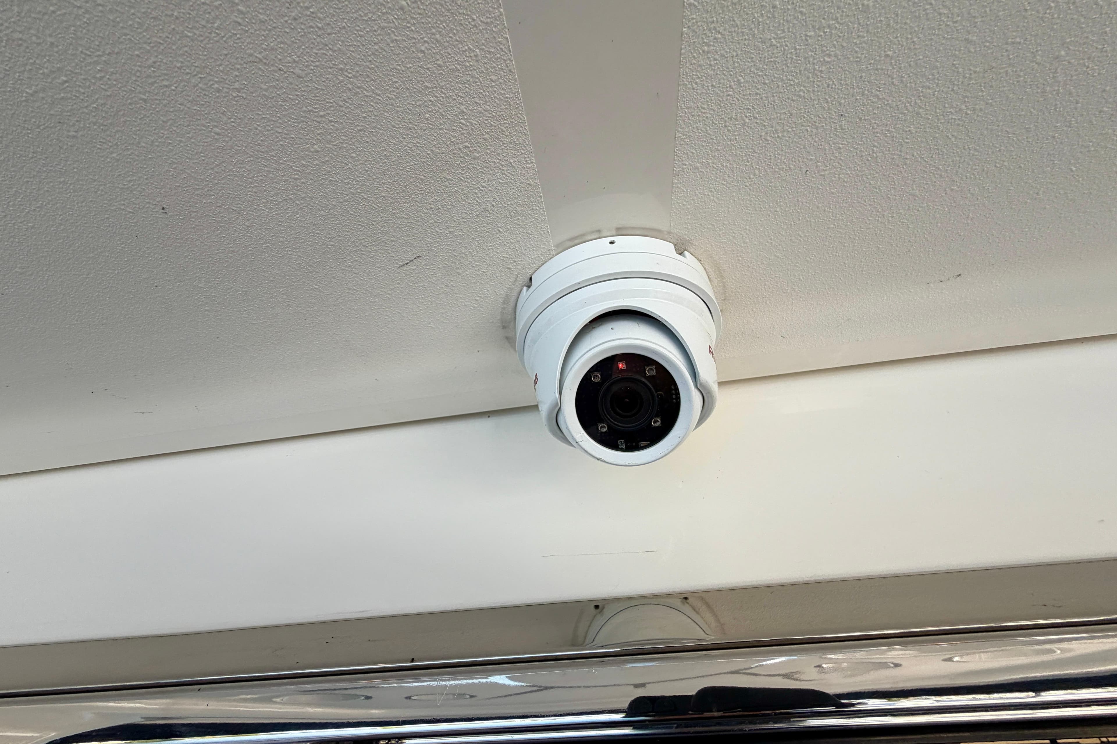 Security camera installed on a 2011 Meridian 441 Sedan ceiling.